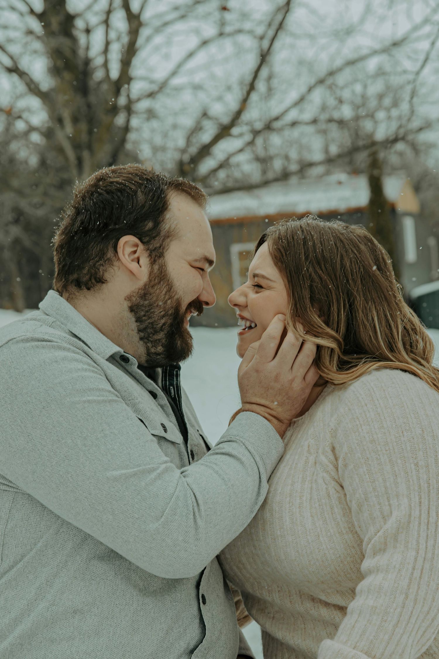A romantic winter engagement photo sequence showing a couple in warm sweaters sharing tender moments in the snow.