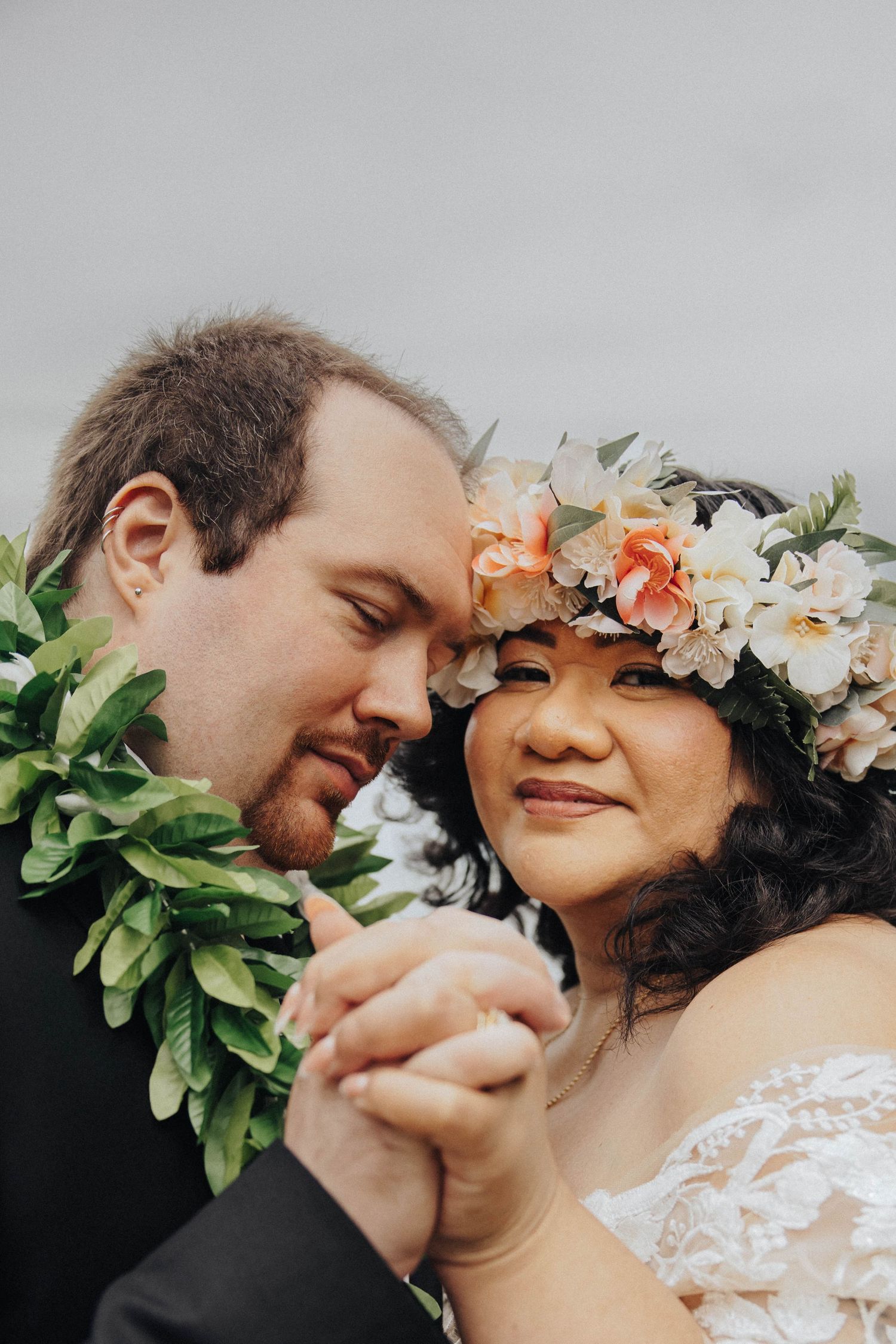 Close-up series of romantic moments with floral crown and white lace dress details in a nature setting.