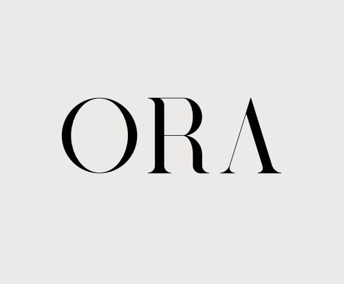 Stylized black text spelling 'ORA' in elegant serif typography against a light gray background.