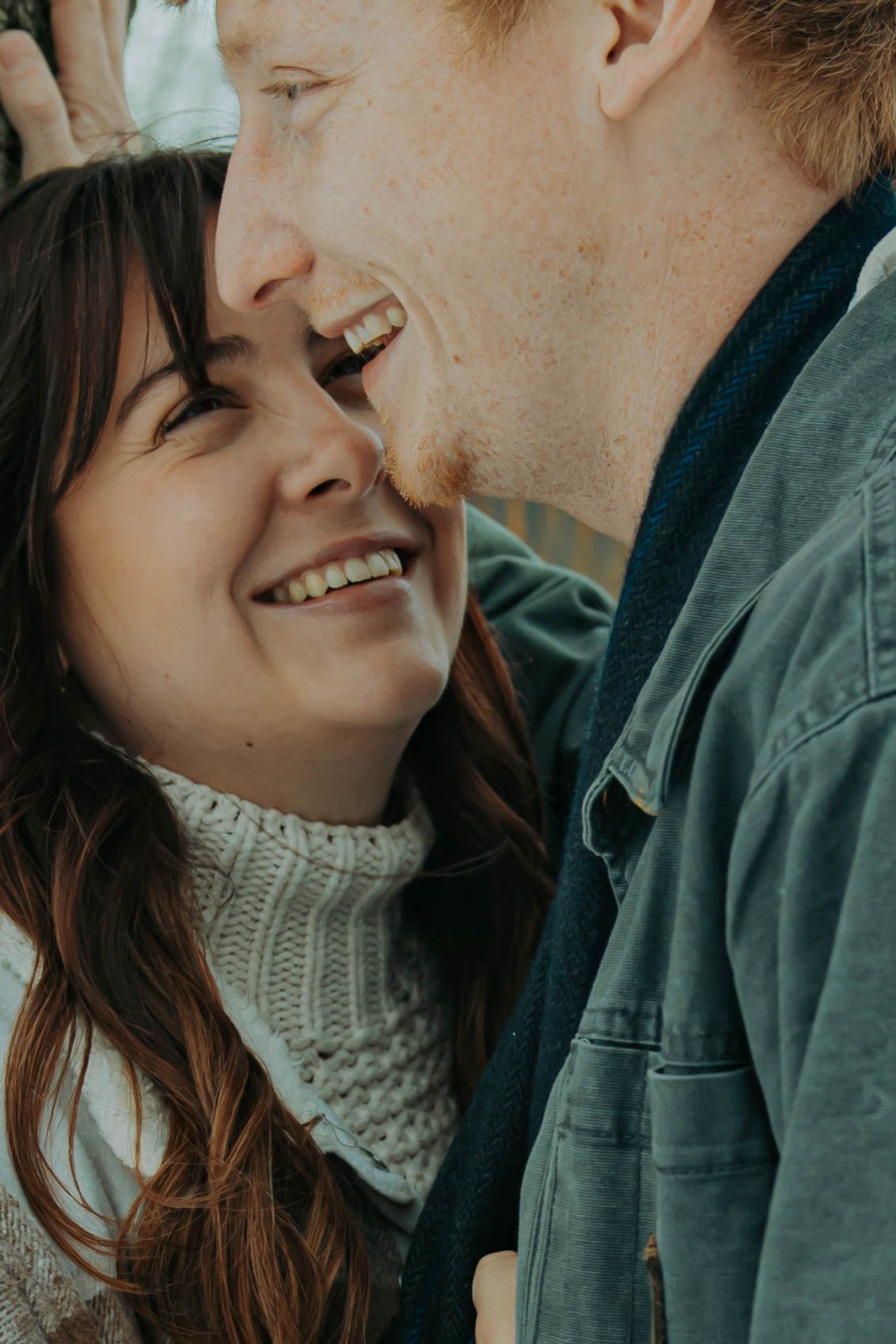 A couple shares an intimate moment wearing a turtleneck sweater and denim jacket in a close-up series of photos.