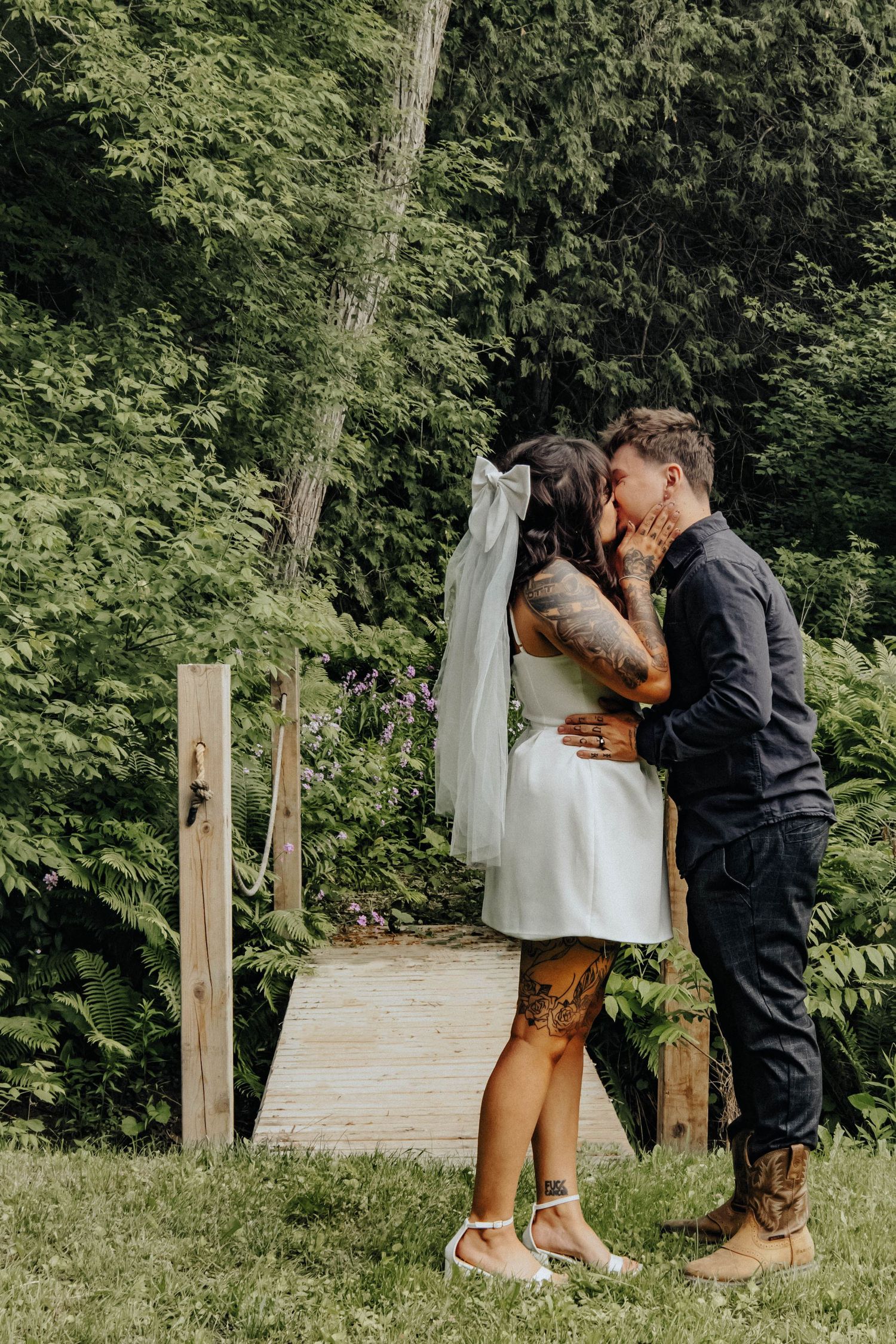 A romantic woodland photoshoot sequence showing an intimate moment between two people near a wooden fence.