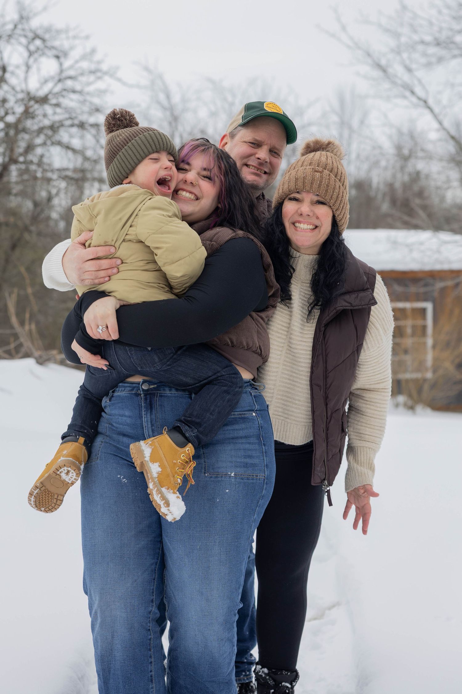 Series of candid moments showing friends embracing and laughing together in the snow.