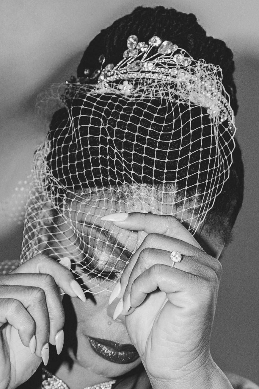 A black and white photo series showing a person in a vintage birdcage veil making expressive poses.