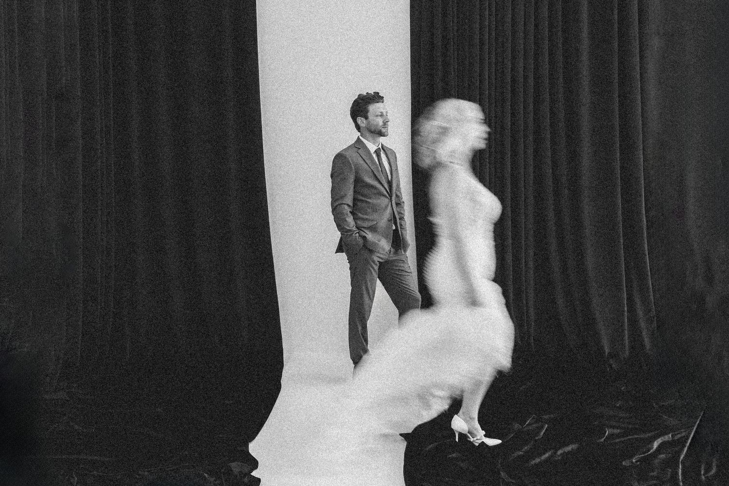 Black and white vertical sequence showing a traditionally dressed bride and groom during various moments of their first dance.