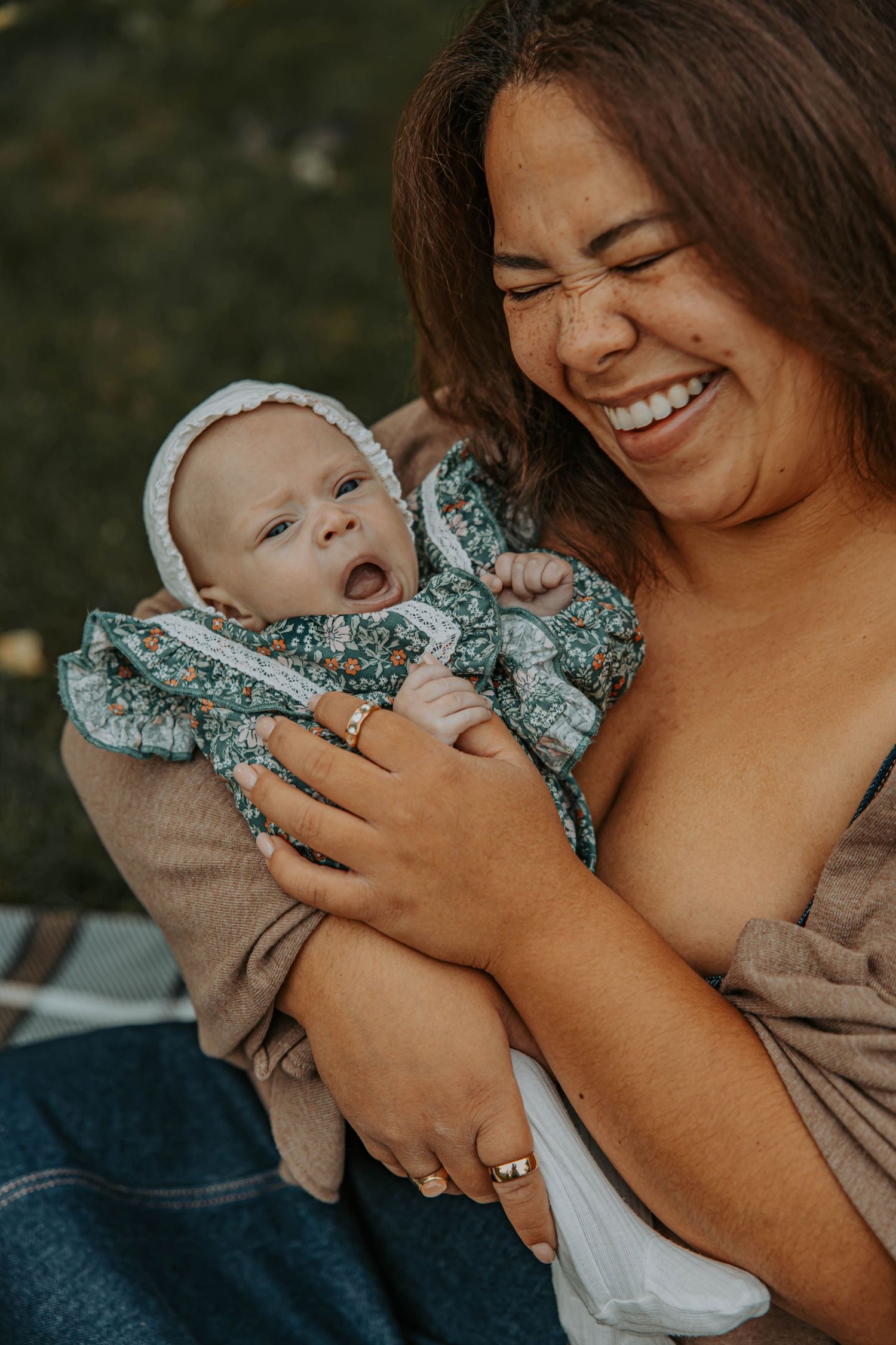 Collection of intimate moments showing a baby in a floral dress being held and cuddled outdoors.