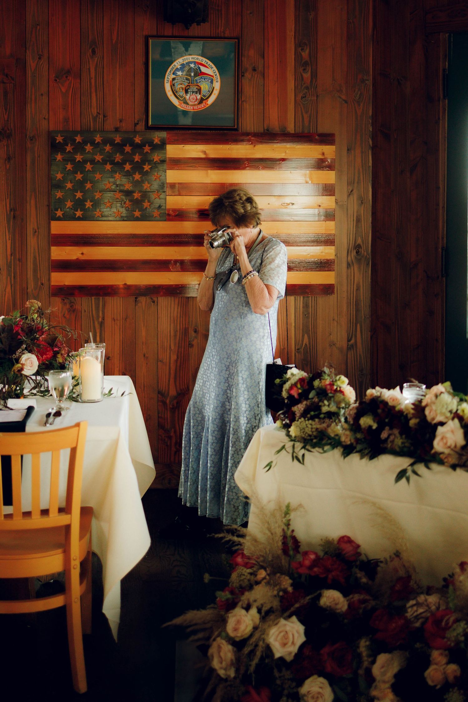 A sequence of wedding photos showing a couple signing documents at a table decorated with floral arrangements and an American flag.