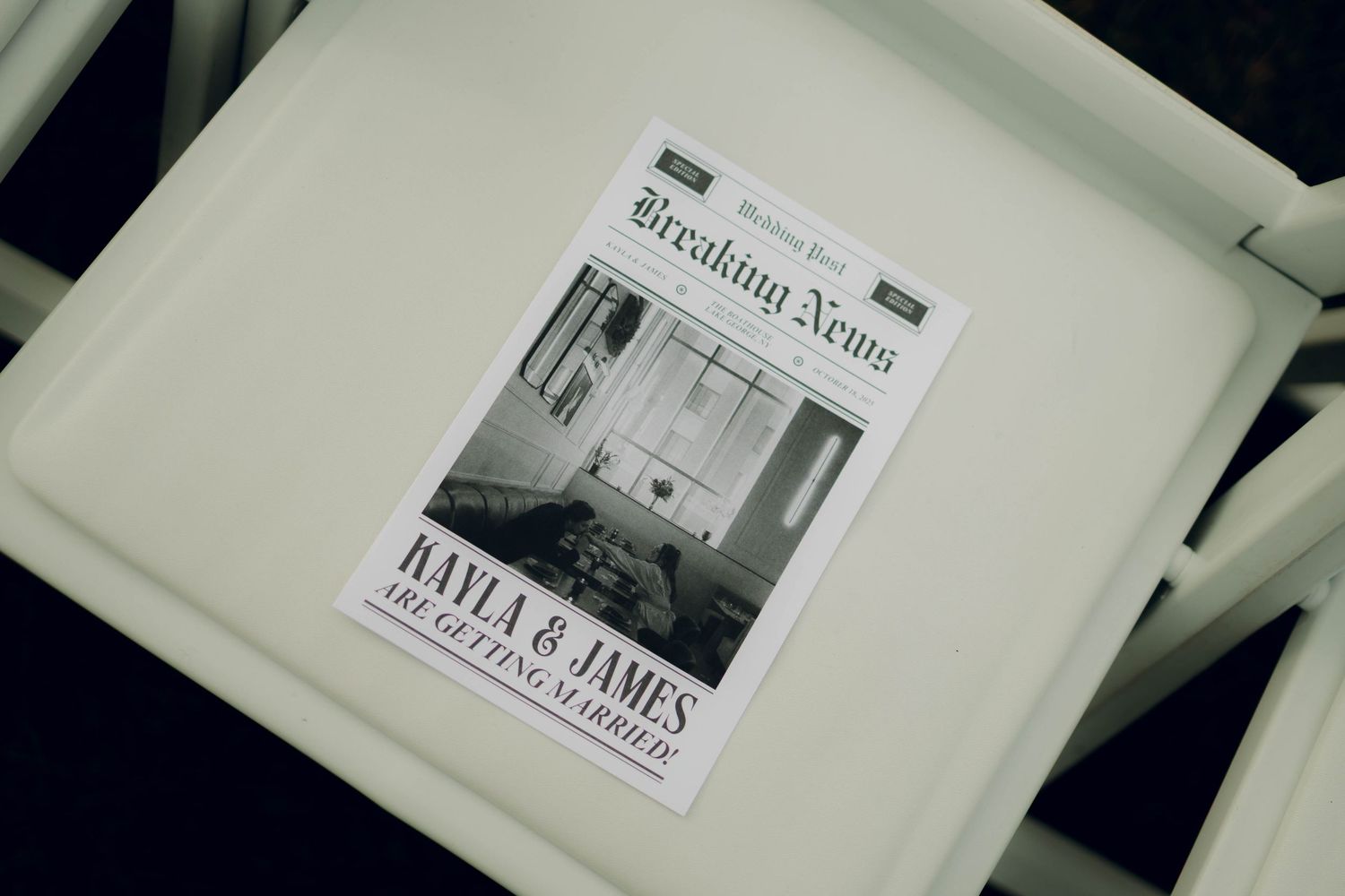 Black and white newspaper clippings displayed on a white surface showing headlines and text.