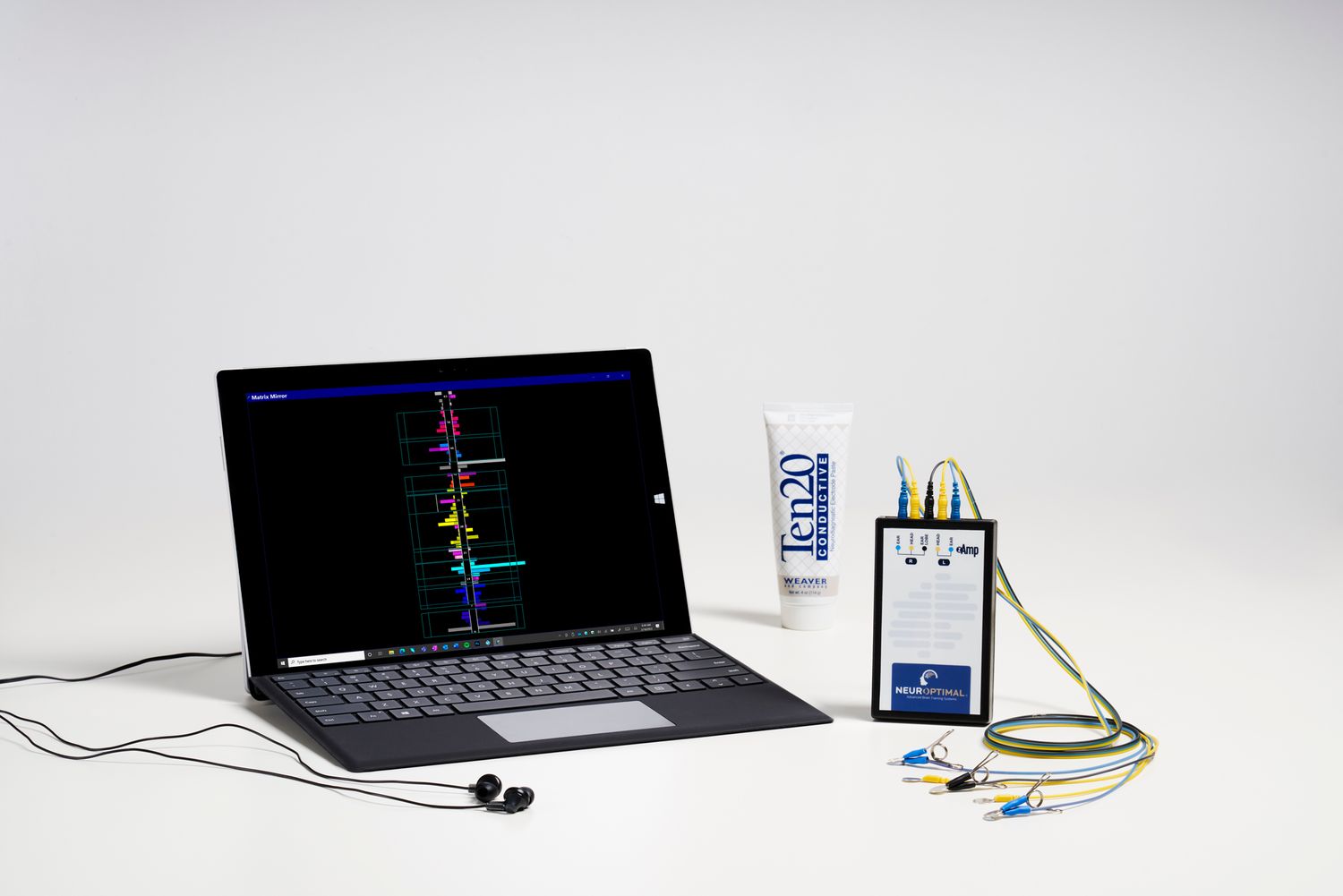 Laptop computer with colorful LED lights and electronic components arranged in a minimalist product photography sequence.