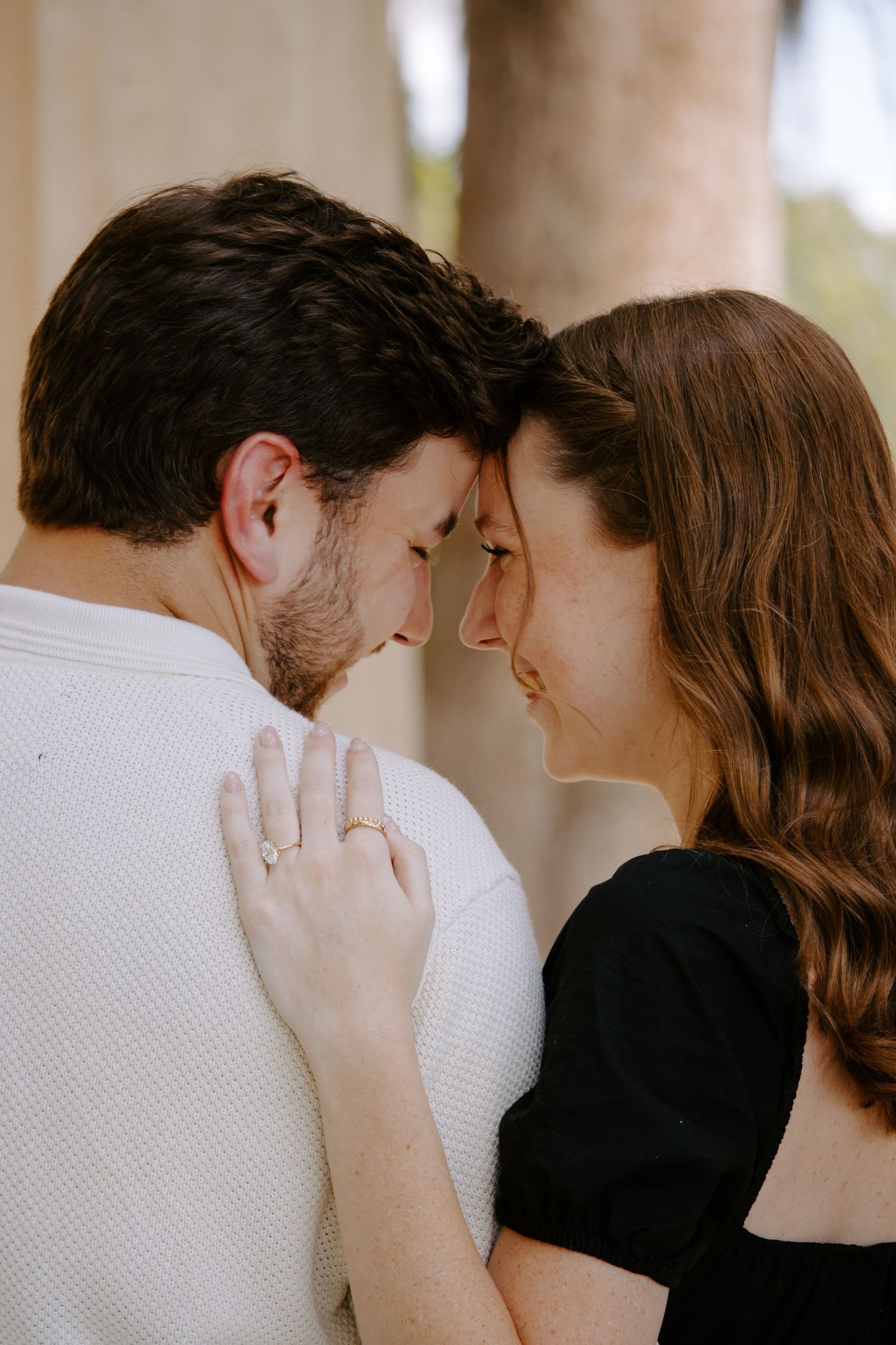 Intimate close-up portraits of couple sharing tender moments.