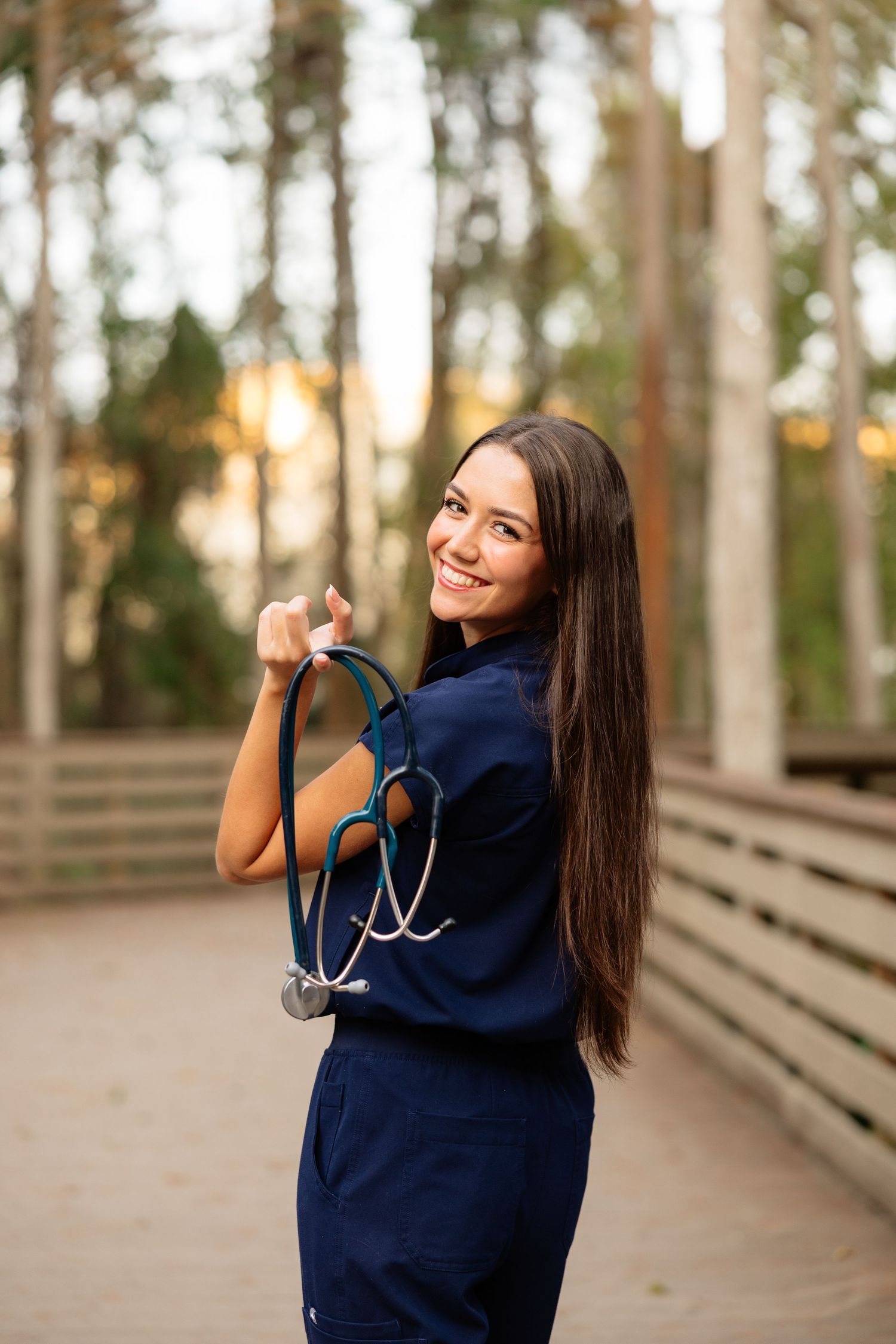 A series of photos showing someone in a navy blue sweater posing playfully against a wooden walkway background.
