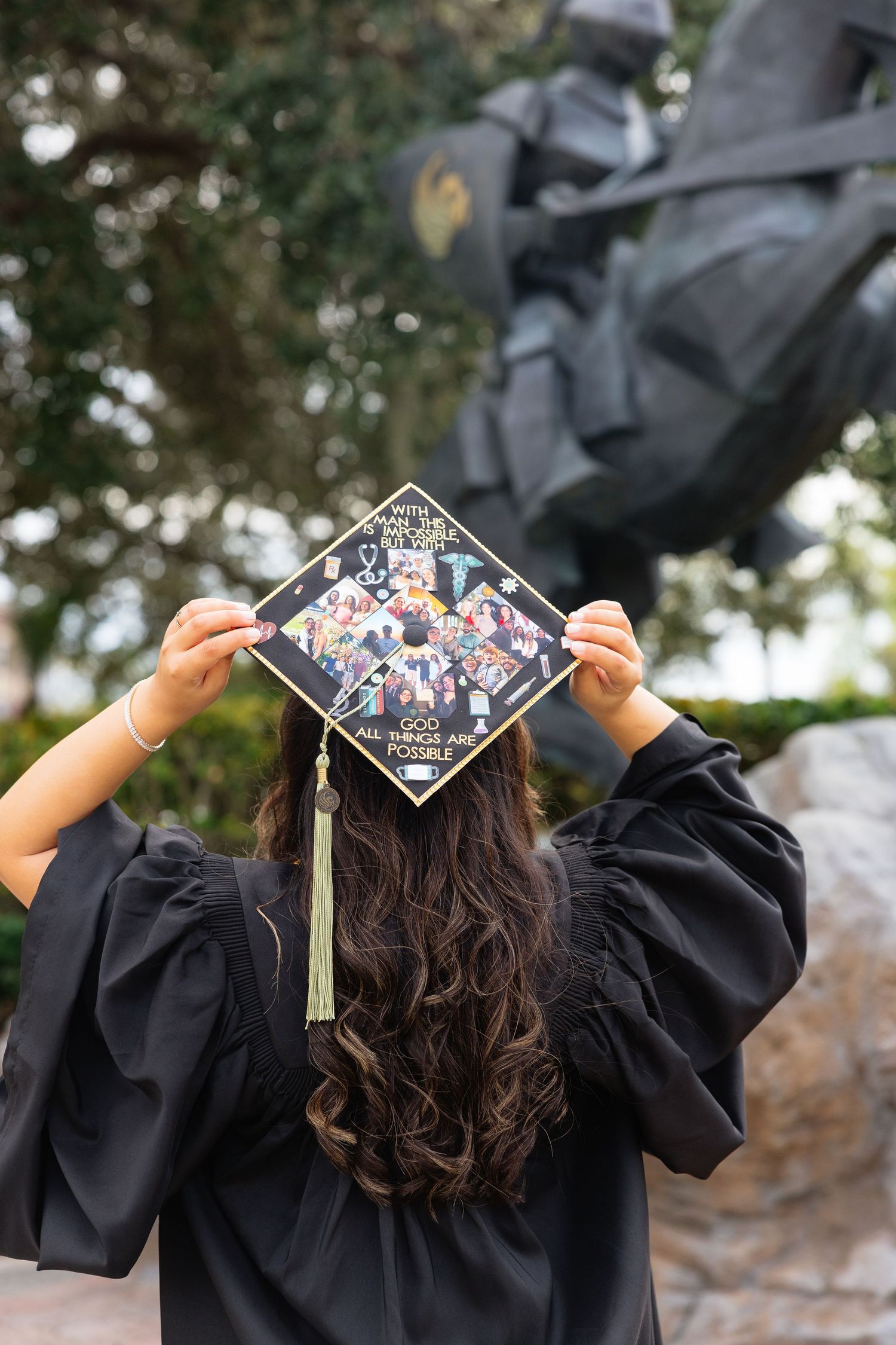 A graduation cap decorated with colorful floral designs shown from multiple angles against a blurred outdoor background.