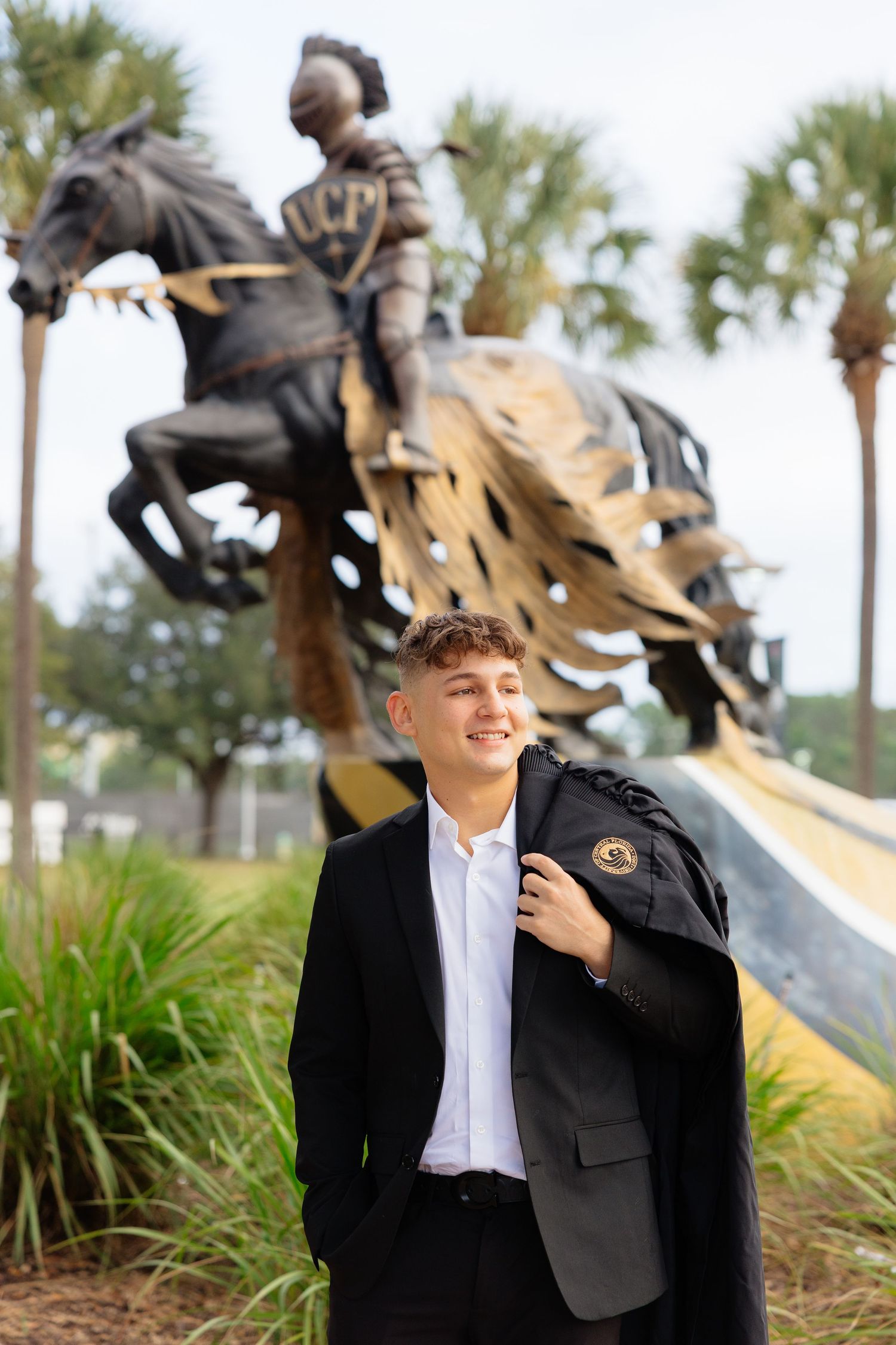 Four sequential photos showing someone in formal attire laughing joyfully outdoors with palm trees in the background.