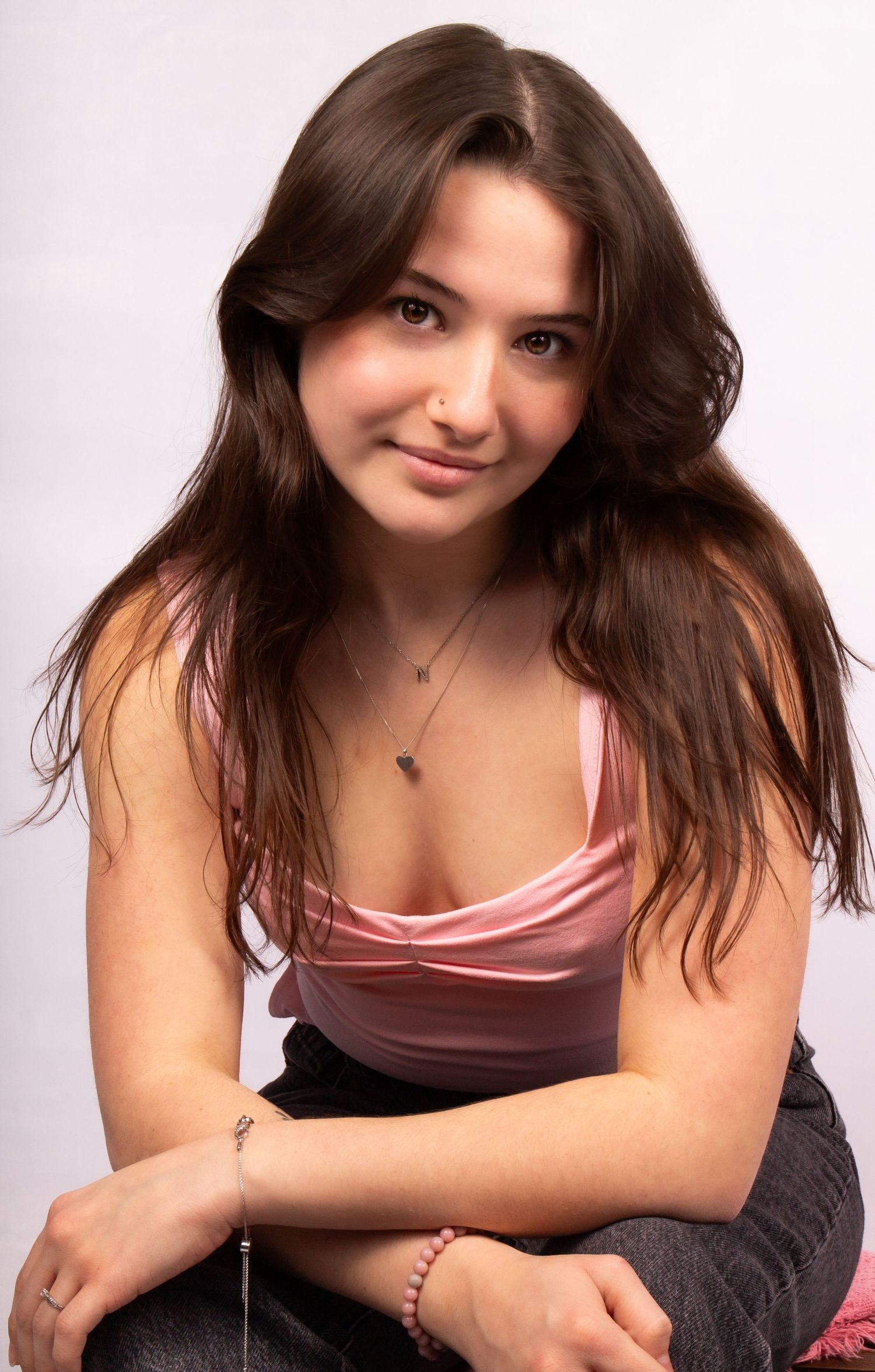 woman leaning forward in studio setting