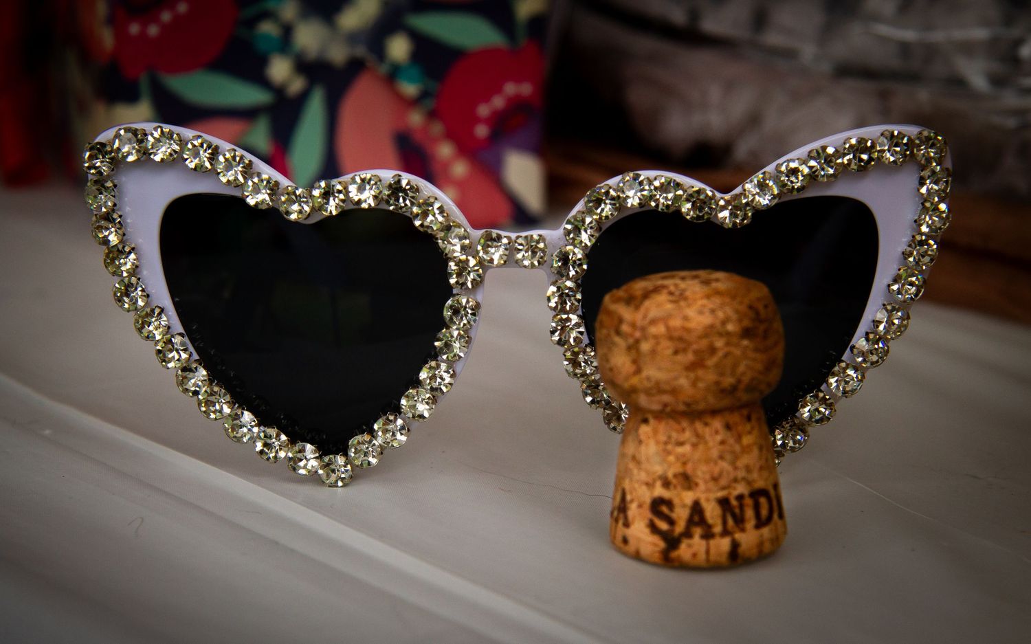 sparkly sunglasses and a wine cork