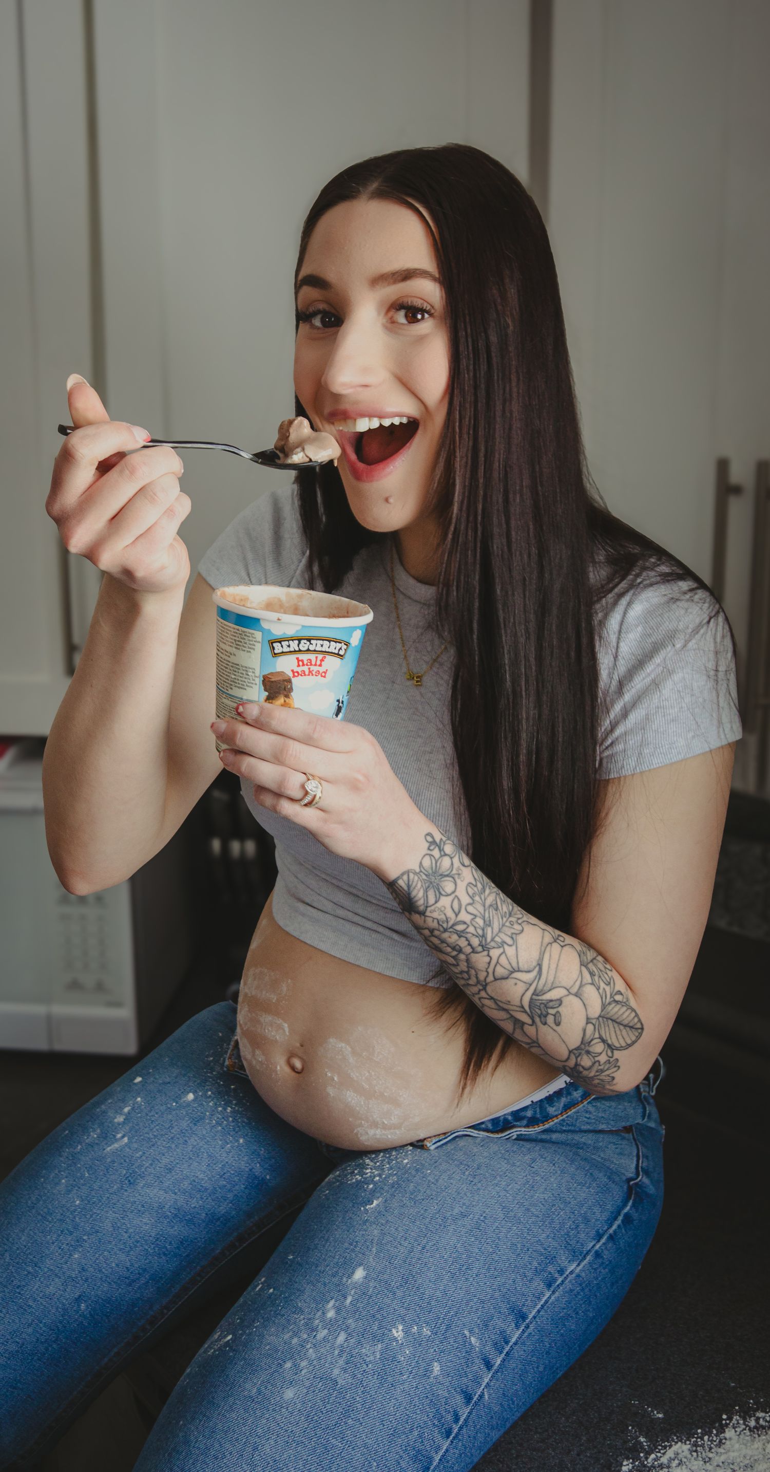 pregnant woman about to eat a bite of icecream