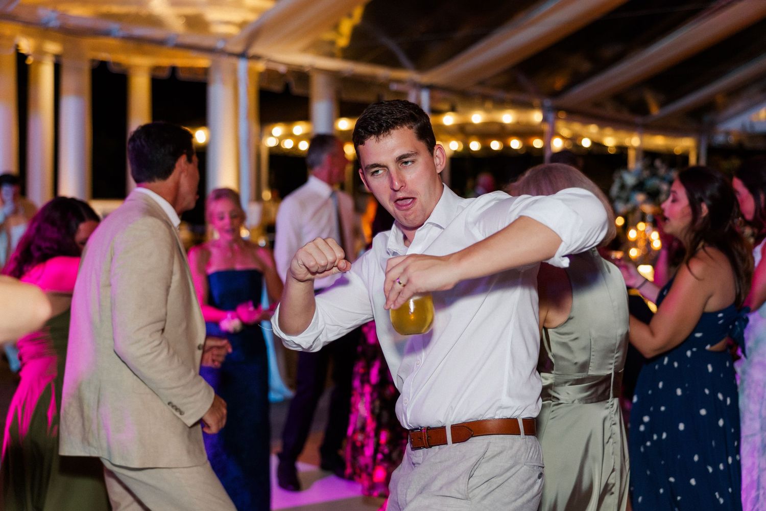 Wedding reception dance floor filled with guests enjoying the celebration.