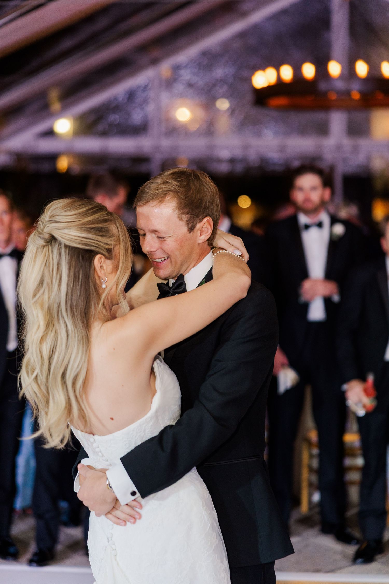 A romantic dance moment captured during an evening wedding reception.