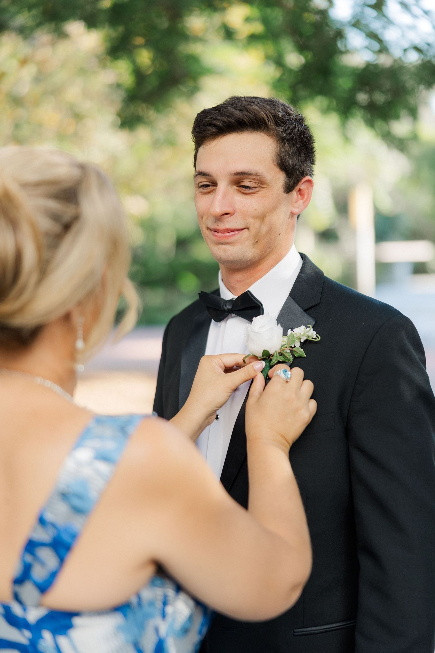 Intimate moment between bride and groom during first look with gentle smiles and loving expressions.
