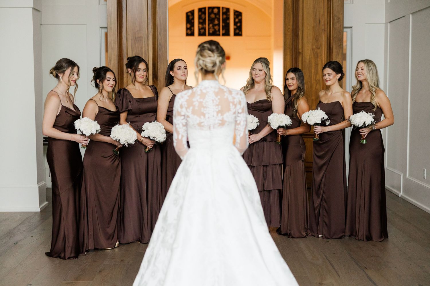 Wedding party poses in a sequence of four photos showing bridesmaids in brown dresses with bride in white gown.