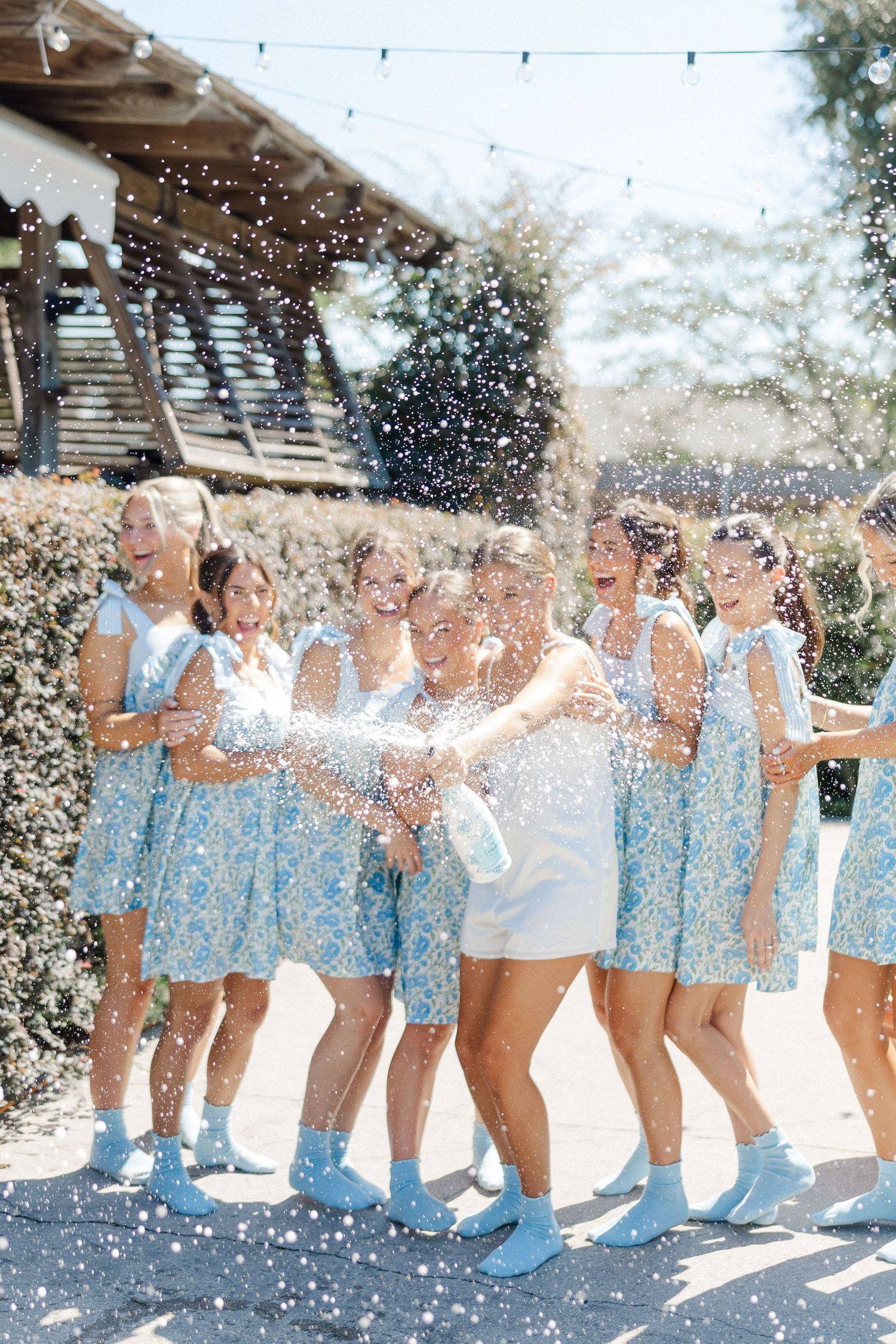 A celebratory moment with confetti flying through the air during an outdoor event.
