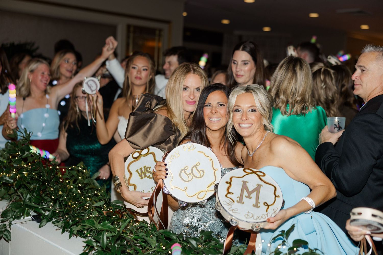 Wedding reception guests enjoying a candid moment together at an elegant evening celebration.