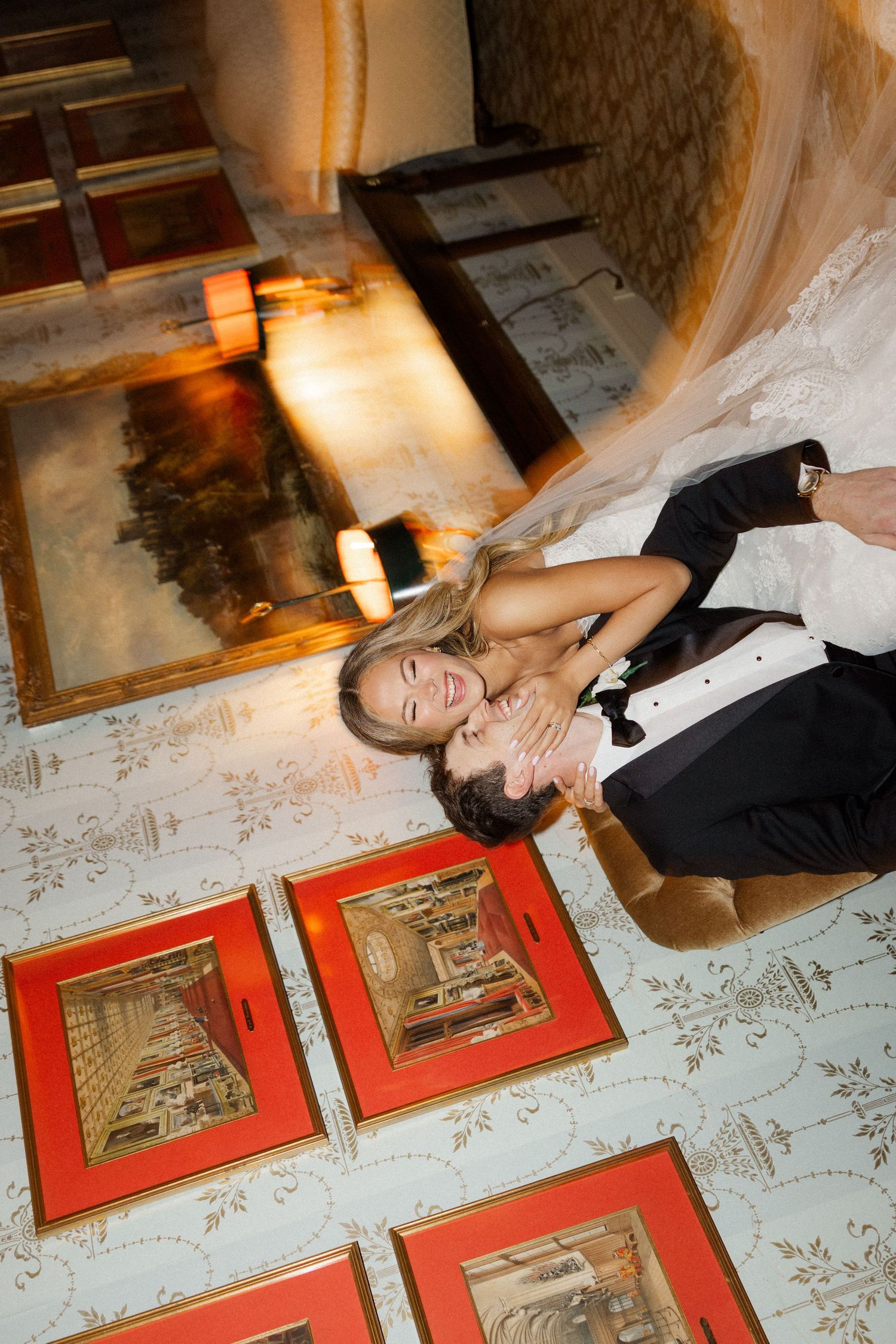 Artistic overhead photo sequence of a couple lying on a patterned floor next to framed artwork.