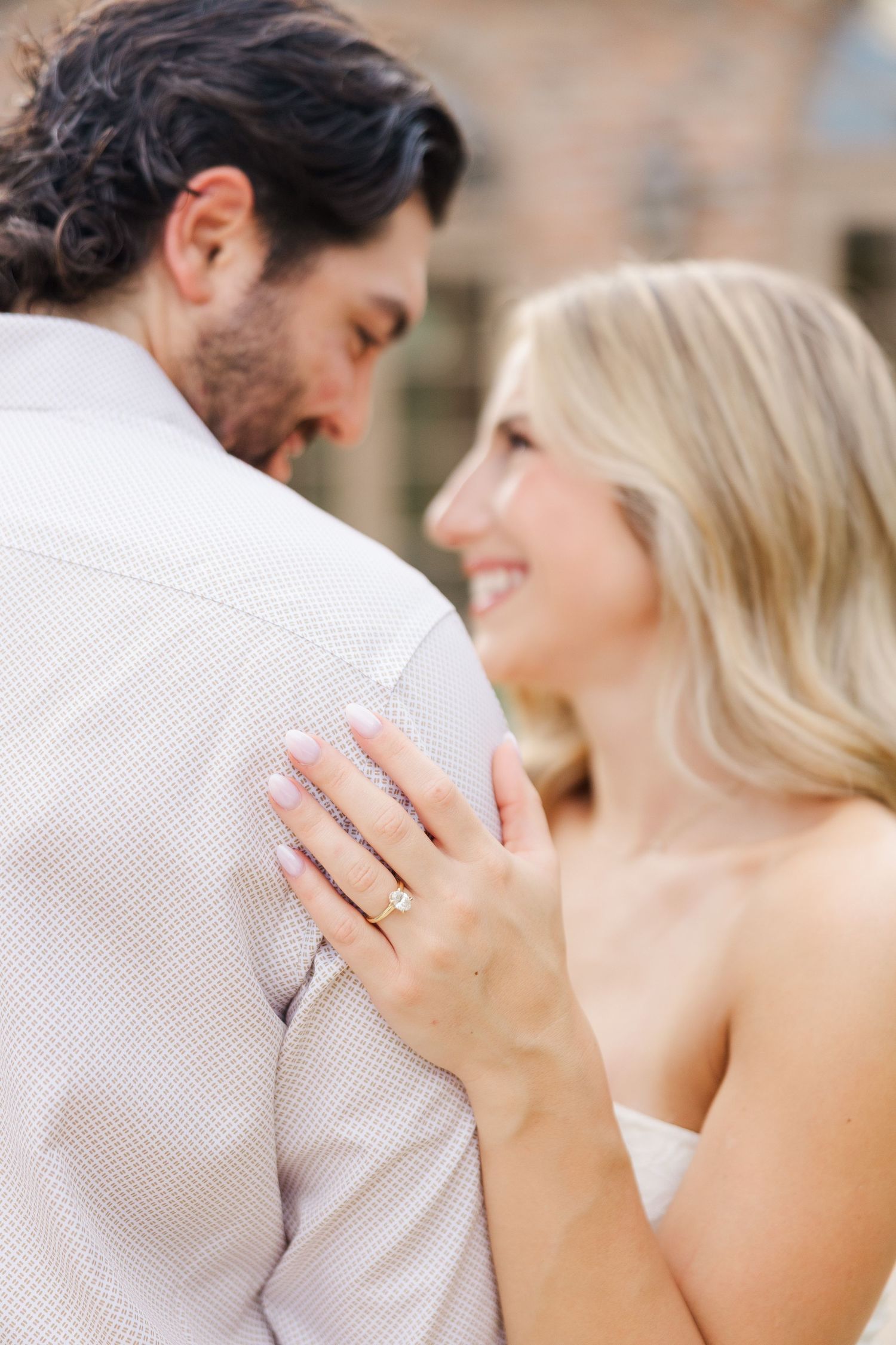 A close-up sequence of a couple in wedding attire sharing an intimate moment together.