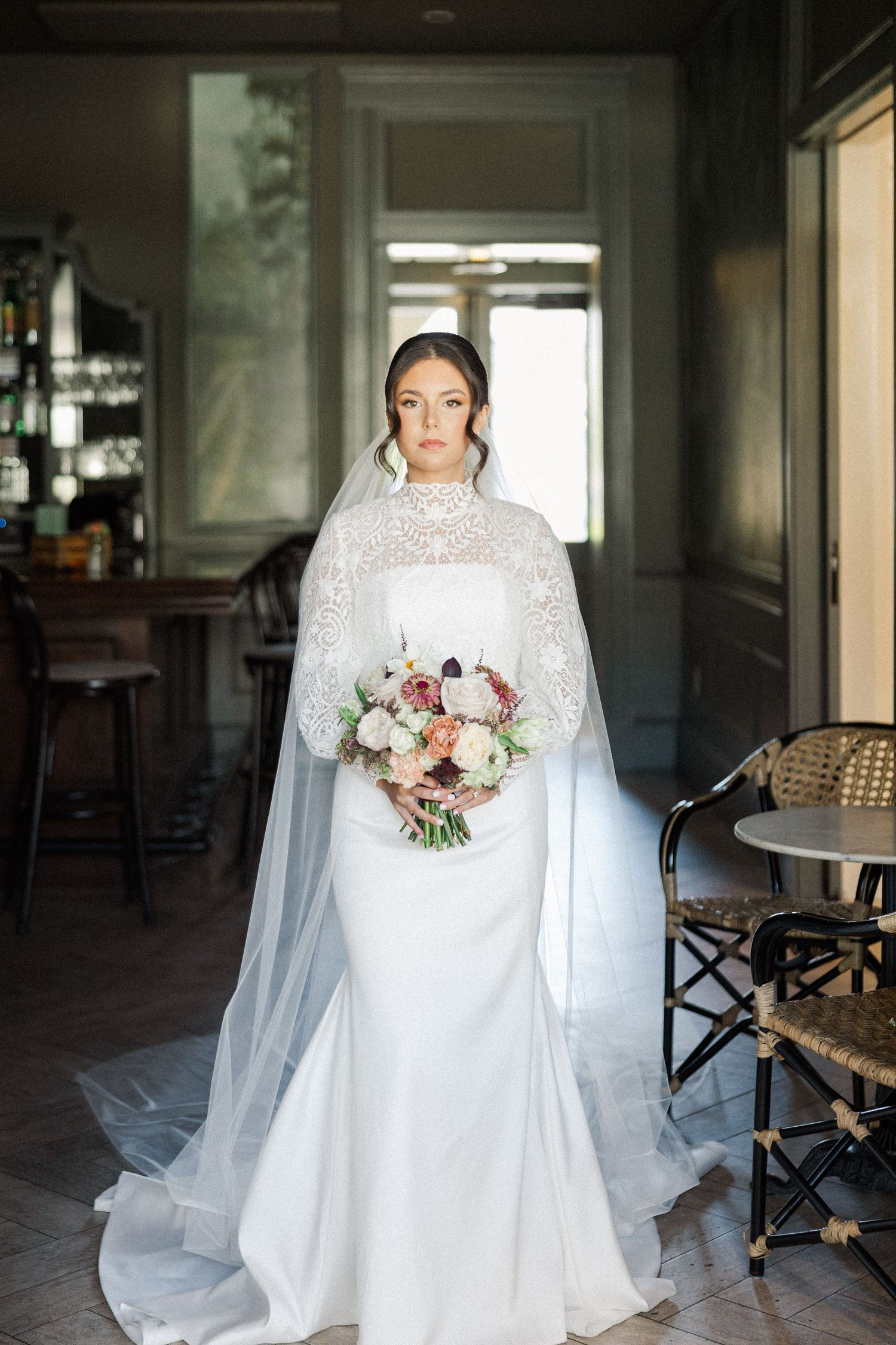 A stunning bridal portrait series showing an elegant white lace wedding gown with long sleeves and flowing veil.
