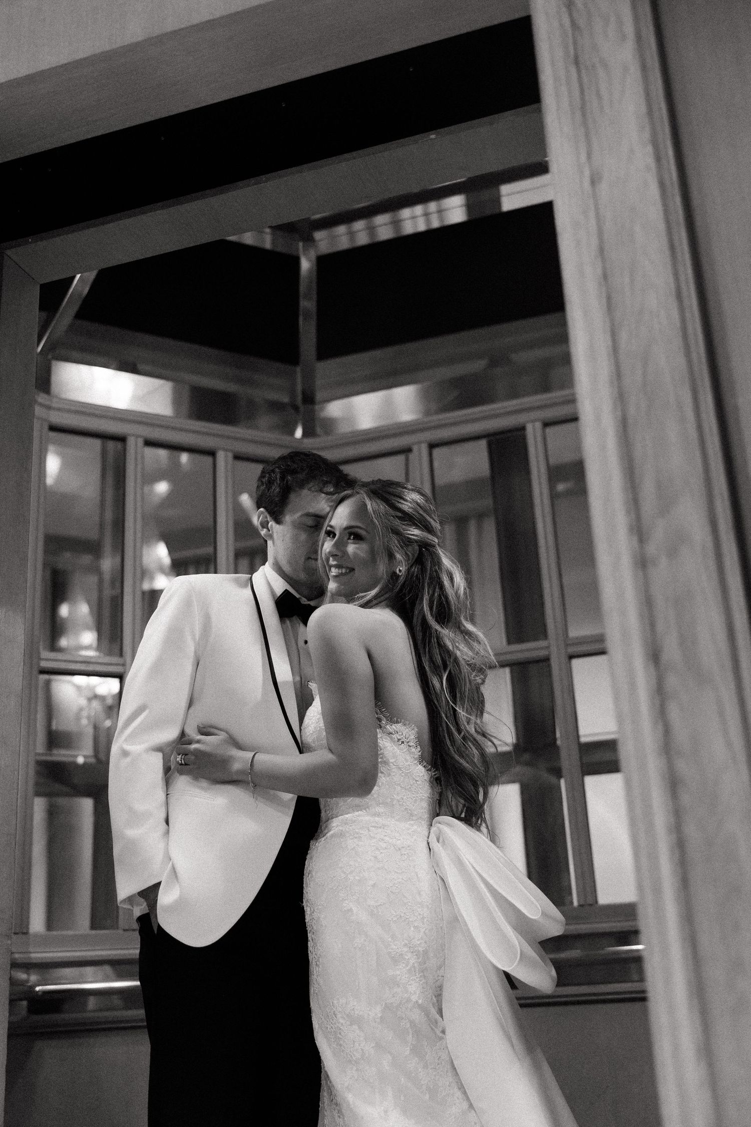 Romantic black and white sequence of a couple dancing together in an intimate setting.