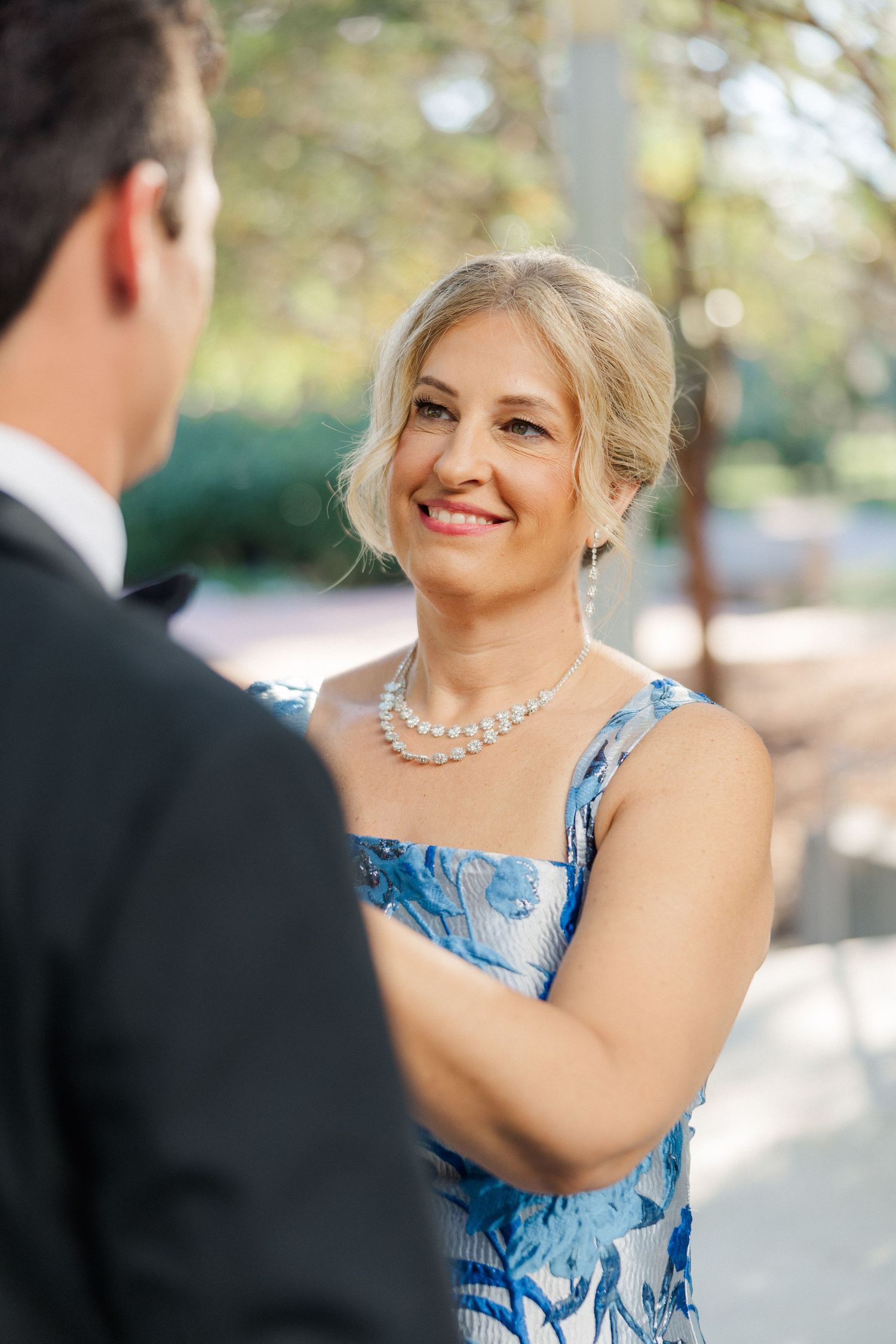 A joyful moment captured during a formal outdoor event.