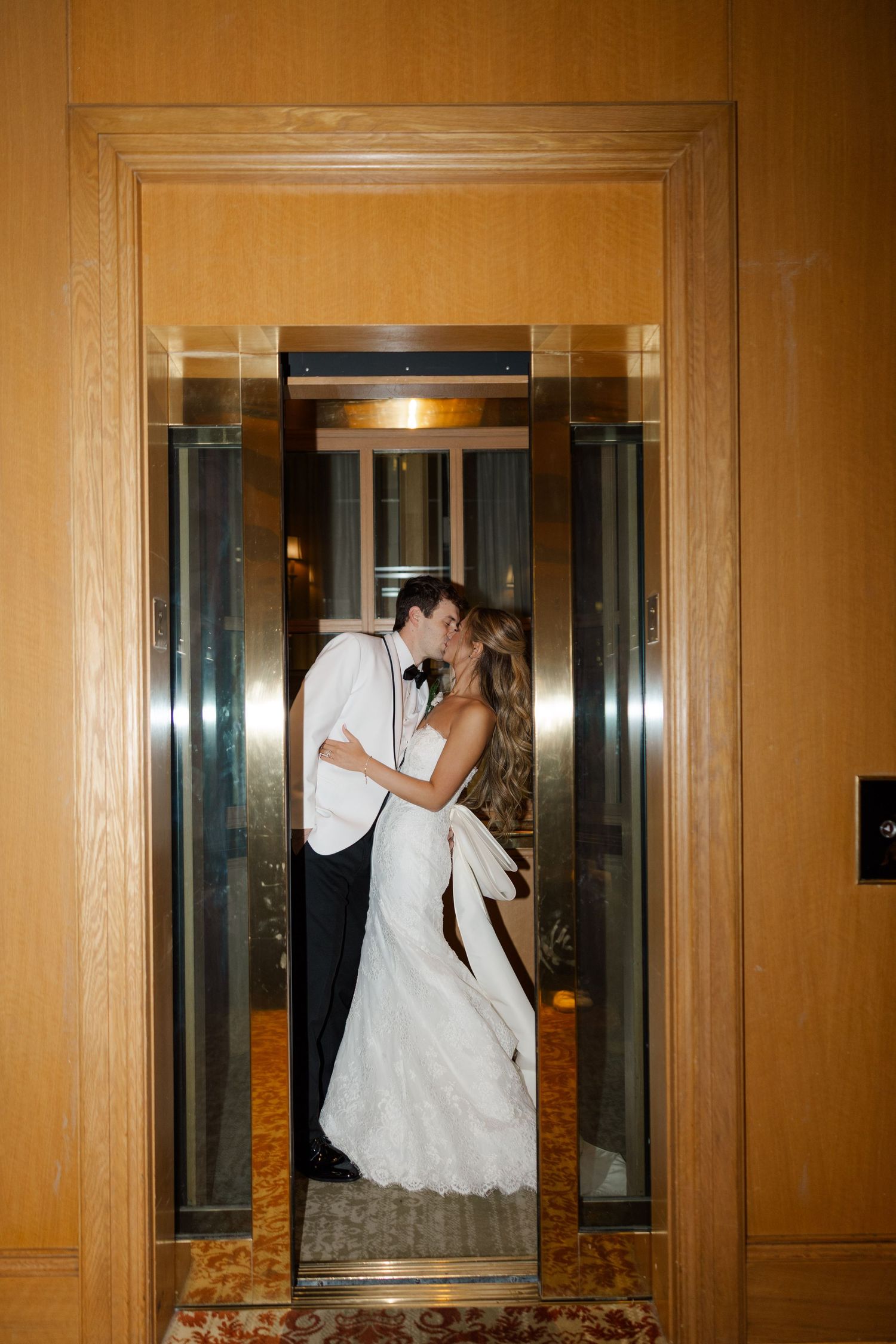 Series of romantic wedding photos captured through elevator door reflections.