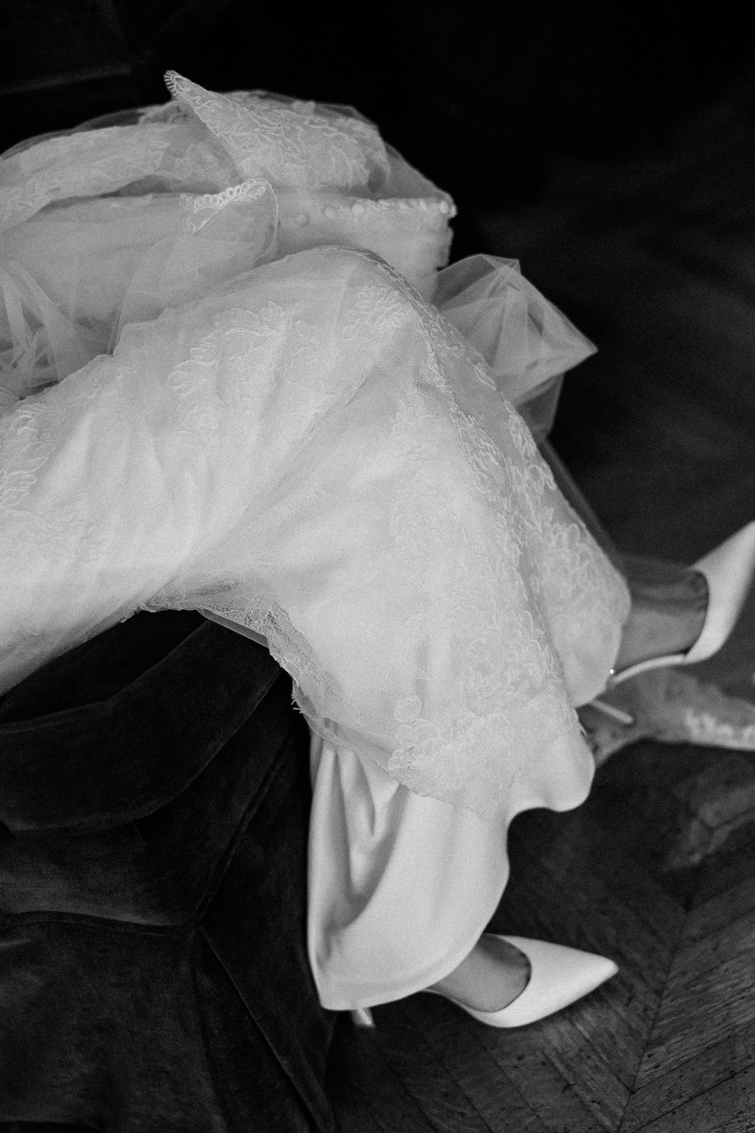 Dramatic black and white close-up shots of wedding dress fabric and lace details.