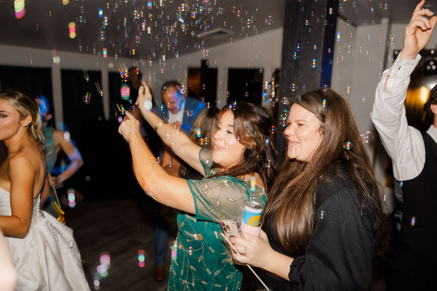 Wedding reception party scene with dramatic lighting and dancing silhouettes.