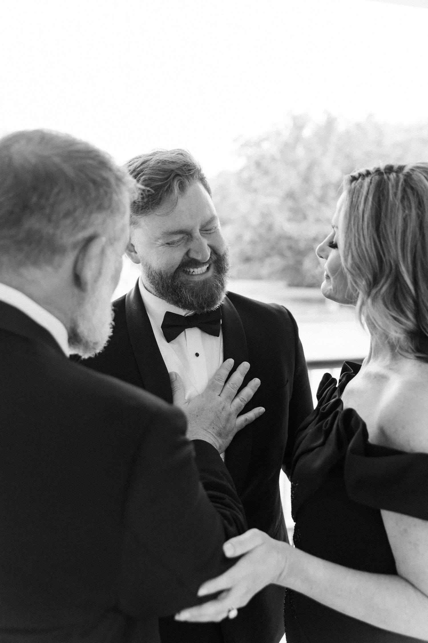 Black and white wedding photo sequence showing intimate close-up moments between a couple.