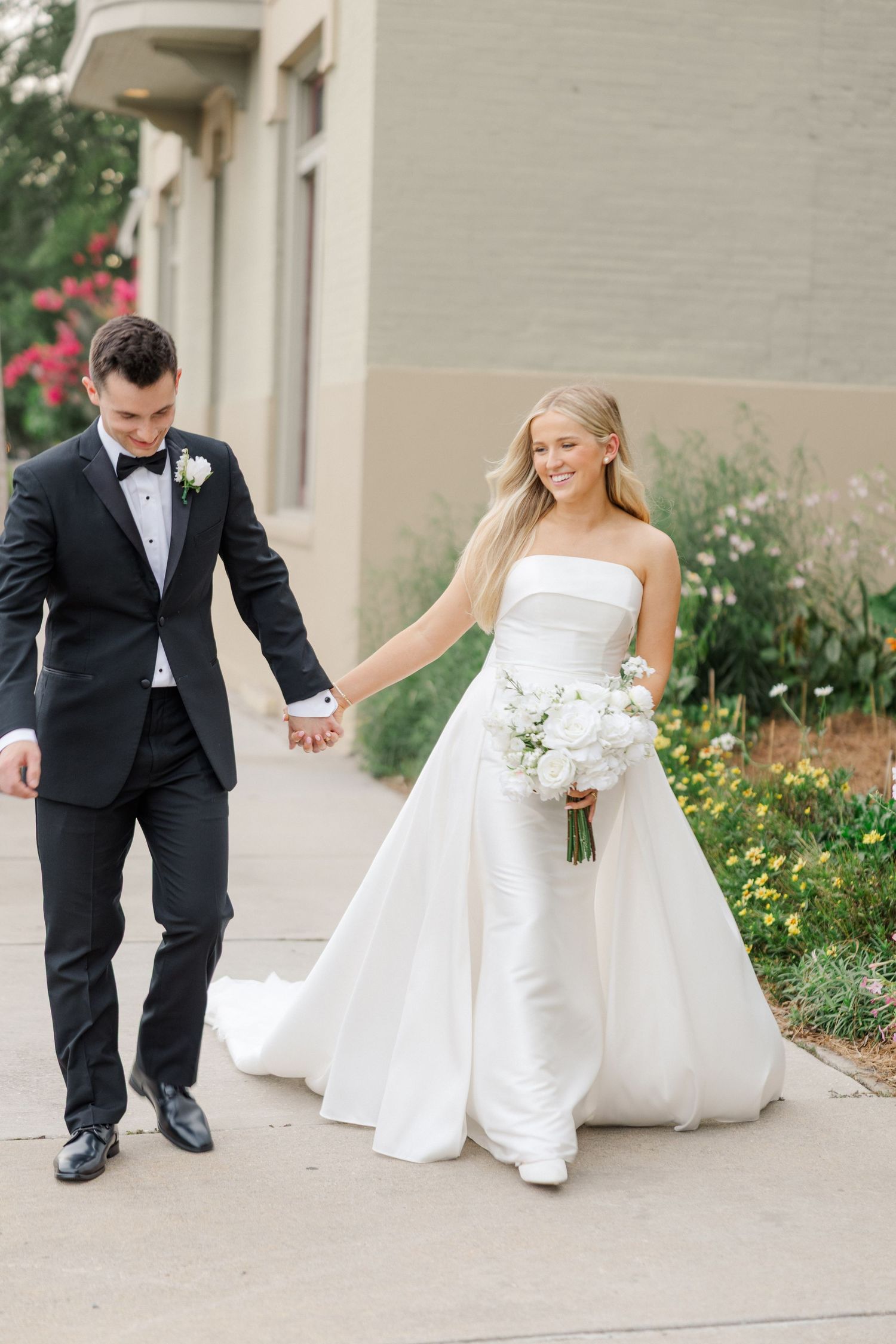 Series of playful wedding photos showing couple walking along garden pathway.