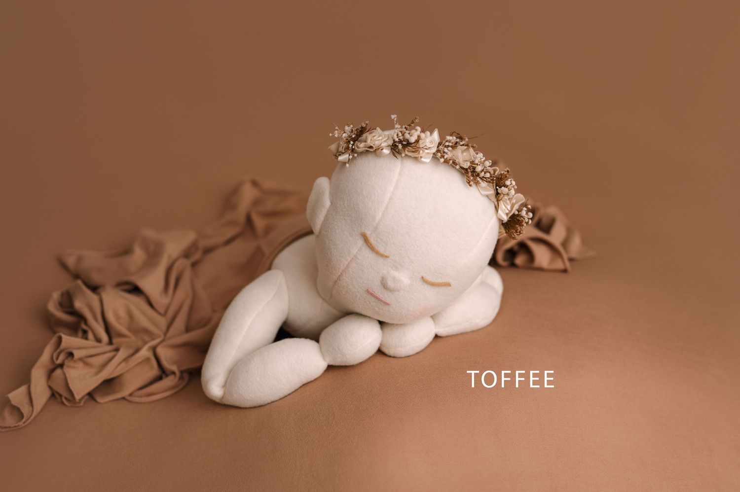 Monochromatic brown tones create a minimalist abstract composition with soft curves and shadows.