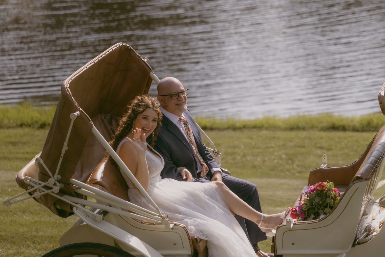 People celebrating their romantic union on a boat dock near the water during a golden hour event.