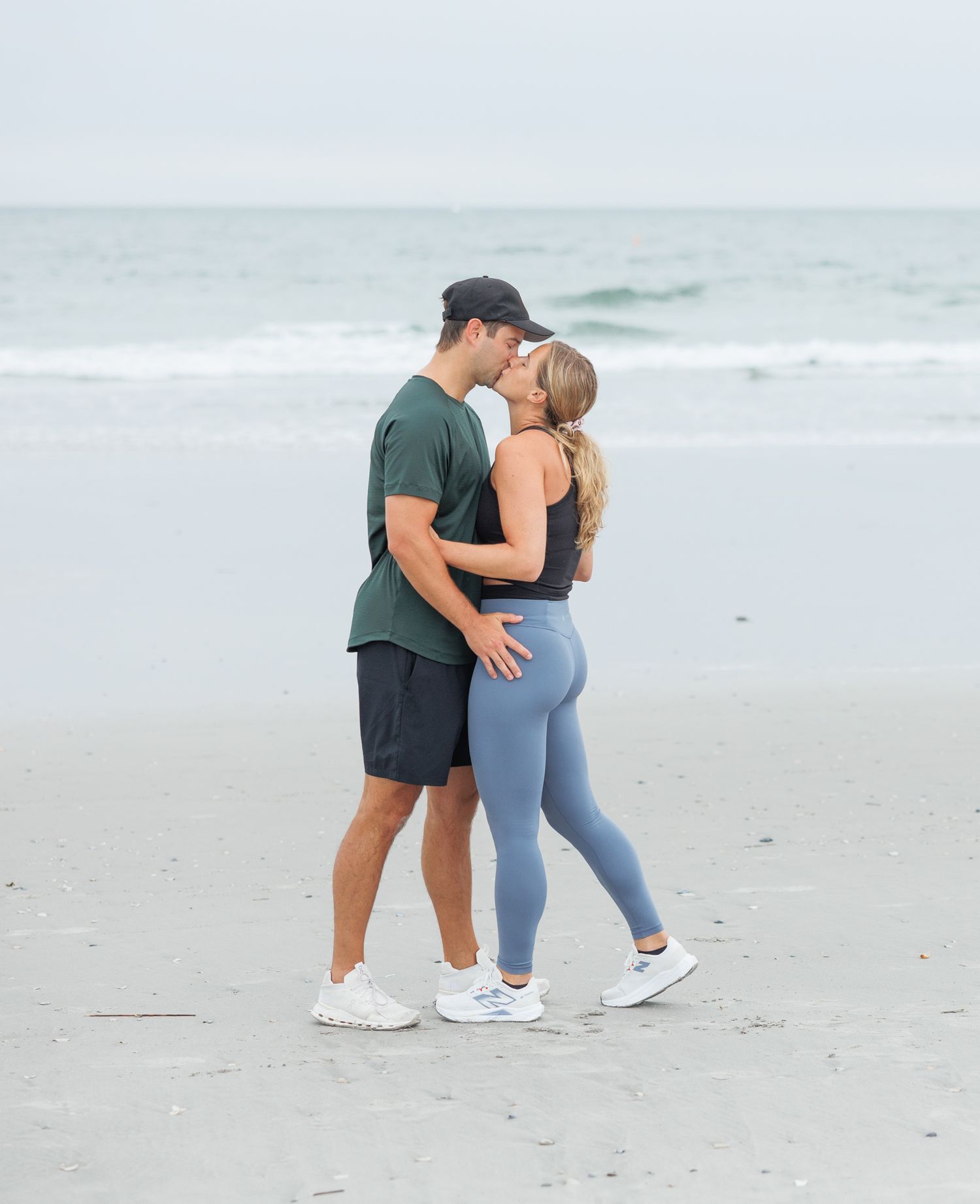 A romantic beach proposal sequence shows a couple embracing on white sand with ocean waves in the background.