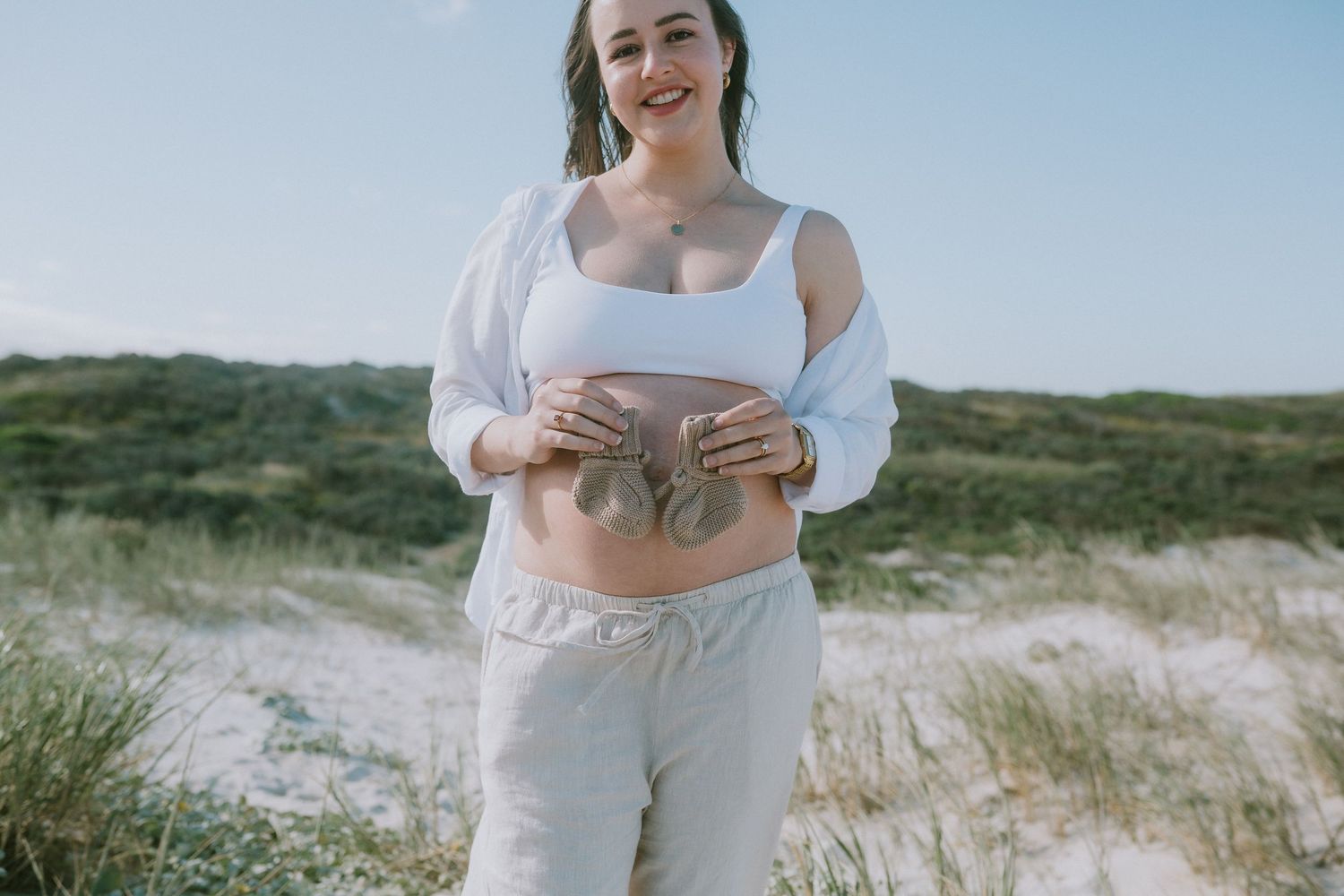 Mother and baby booties at Sarah Lamour Photography beach maternity shoot