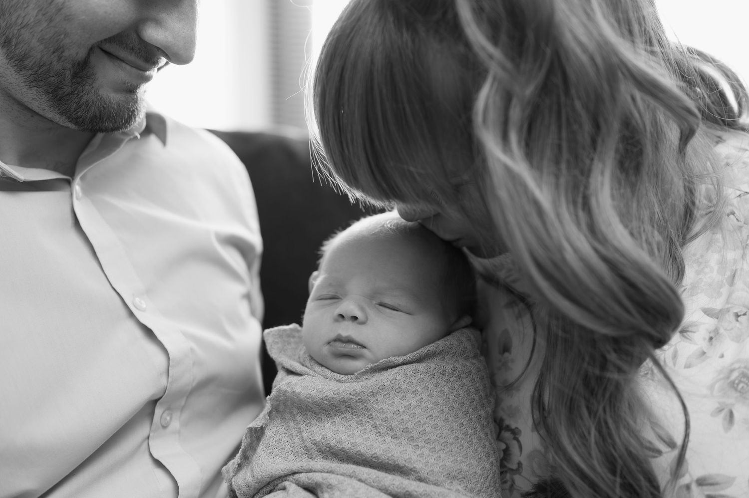 mom kisses baby
