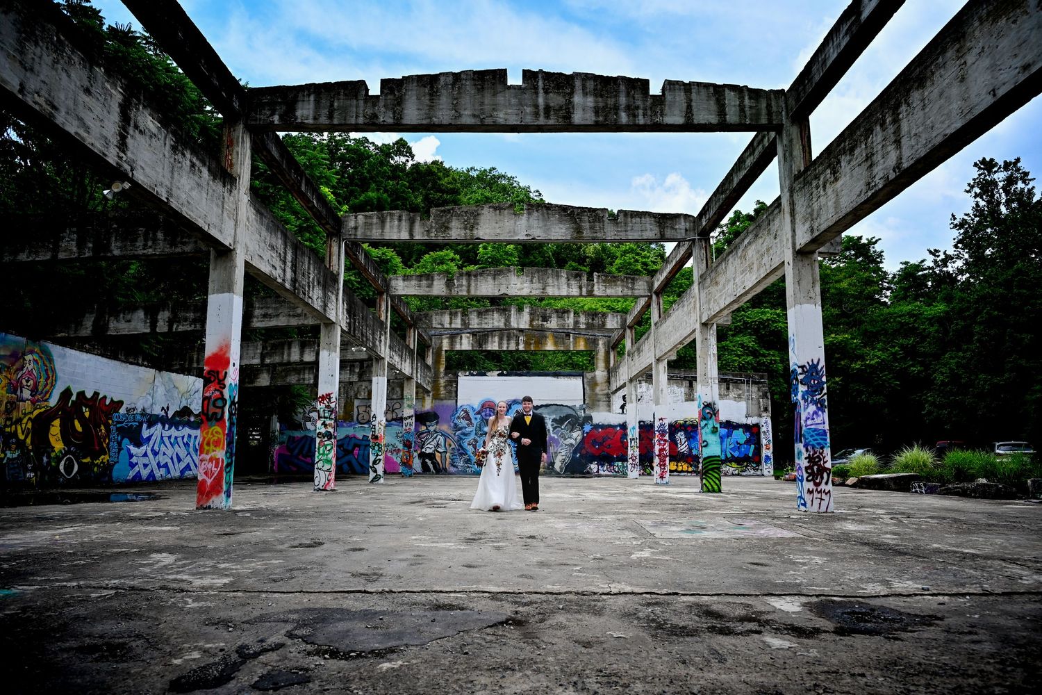 Panoramic series showing abandoned concrete structure with graffiti art and fading paint in urban environment.