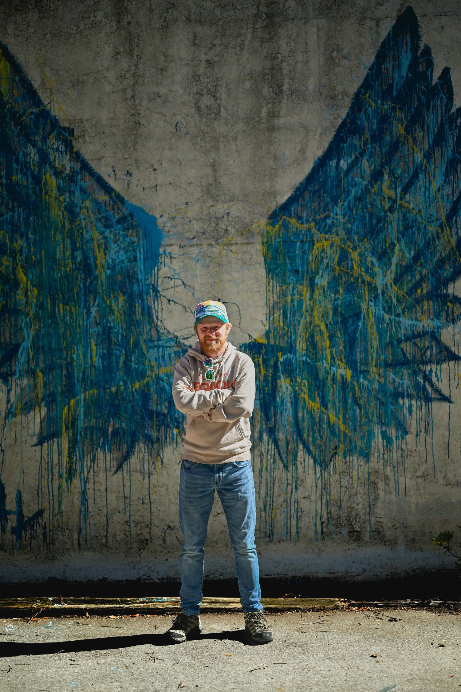A sequence of dance poses shown against a blue graffiti wall background.