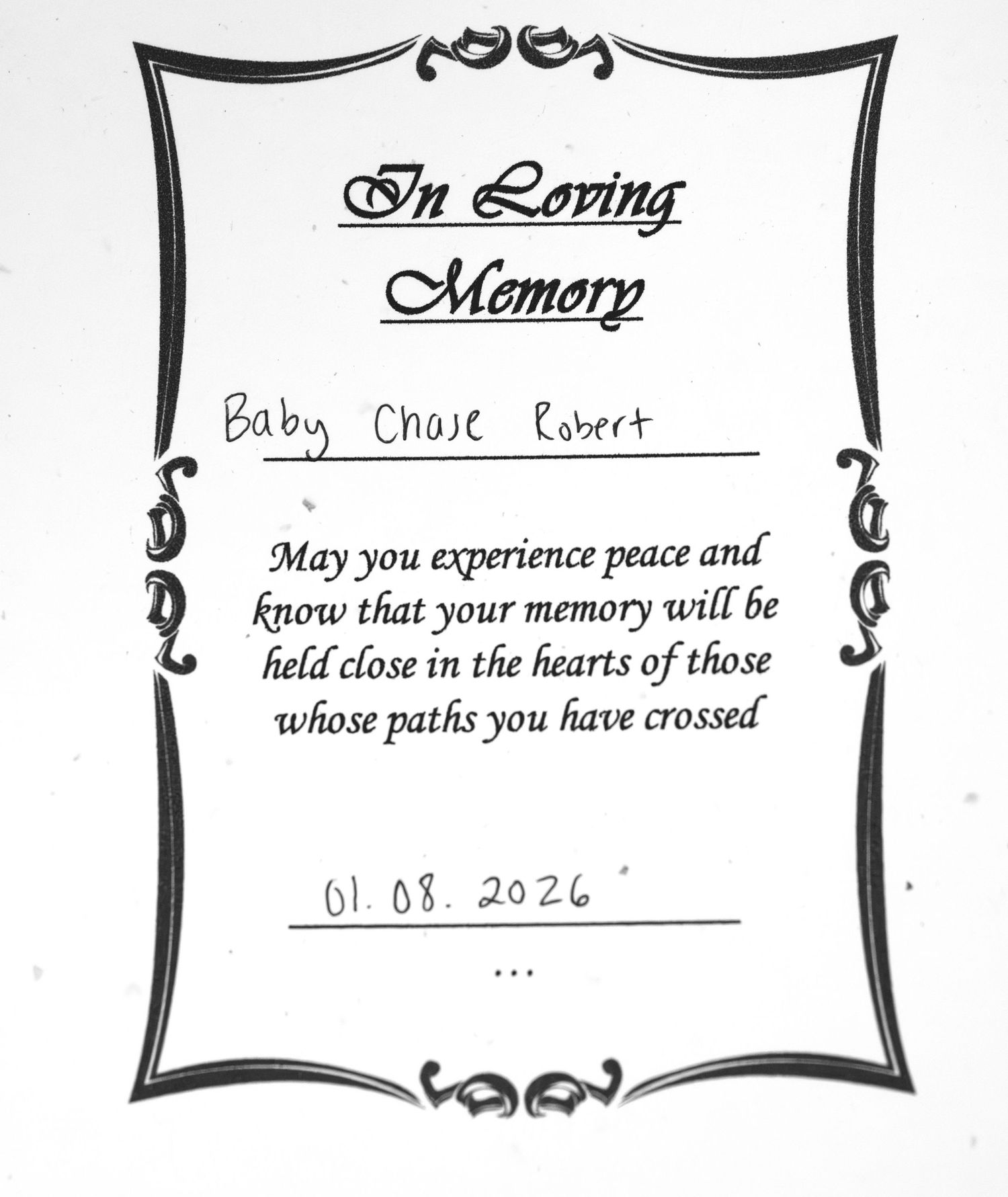 A black and white memorial card with decorative border showing 