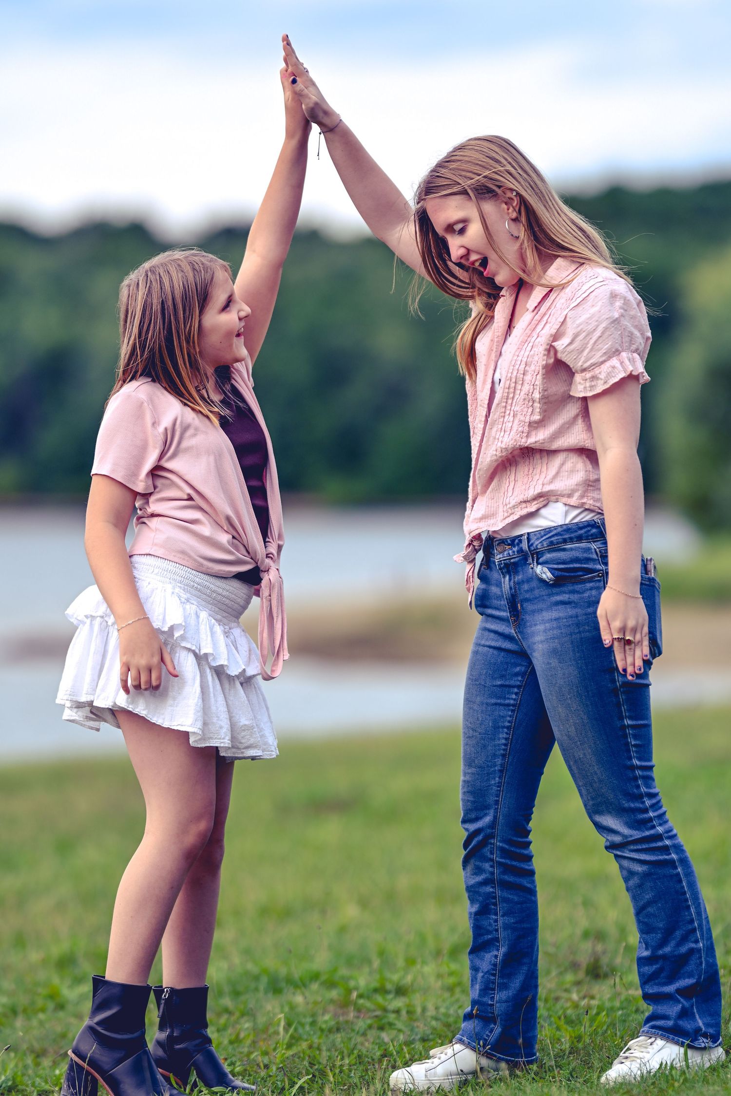 Two girls high five