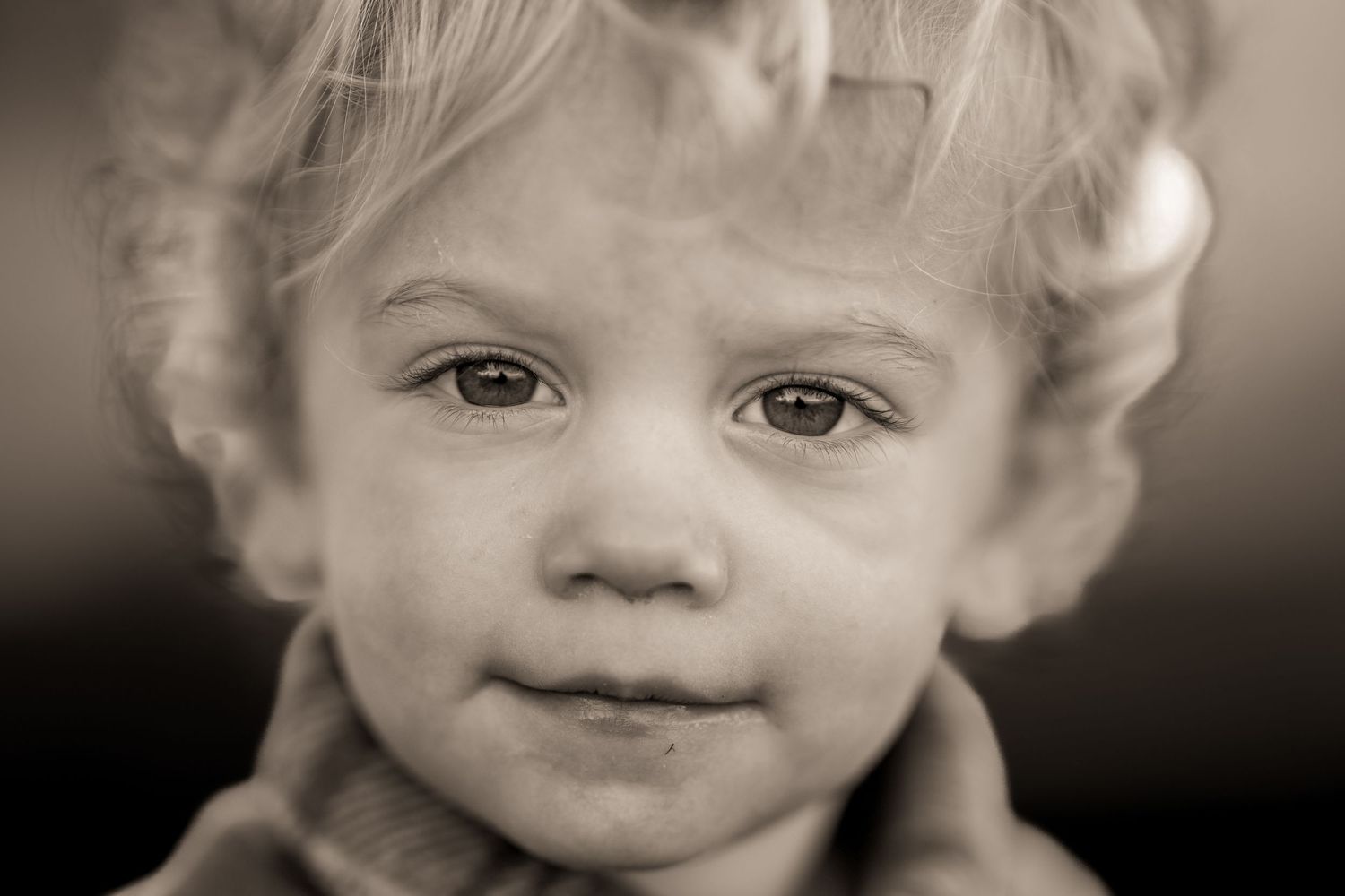 Black and white portraits showing a young child.