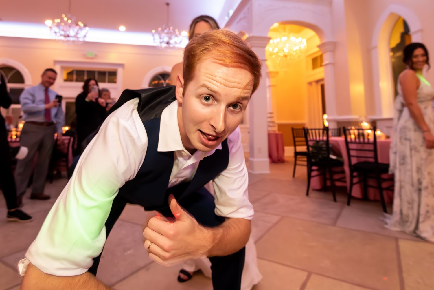 Collage of people dancing and celebrating at a reception event in a ballroom setting.