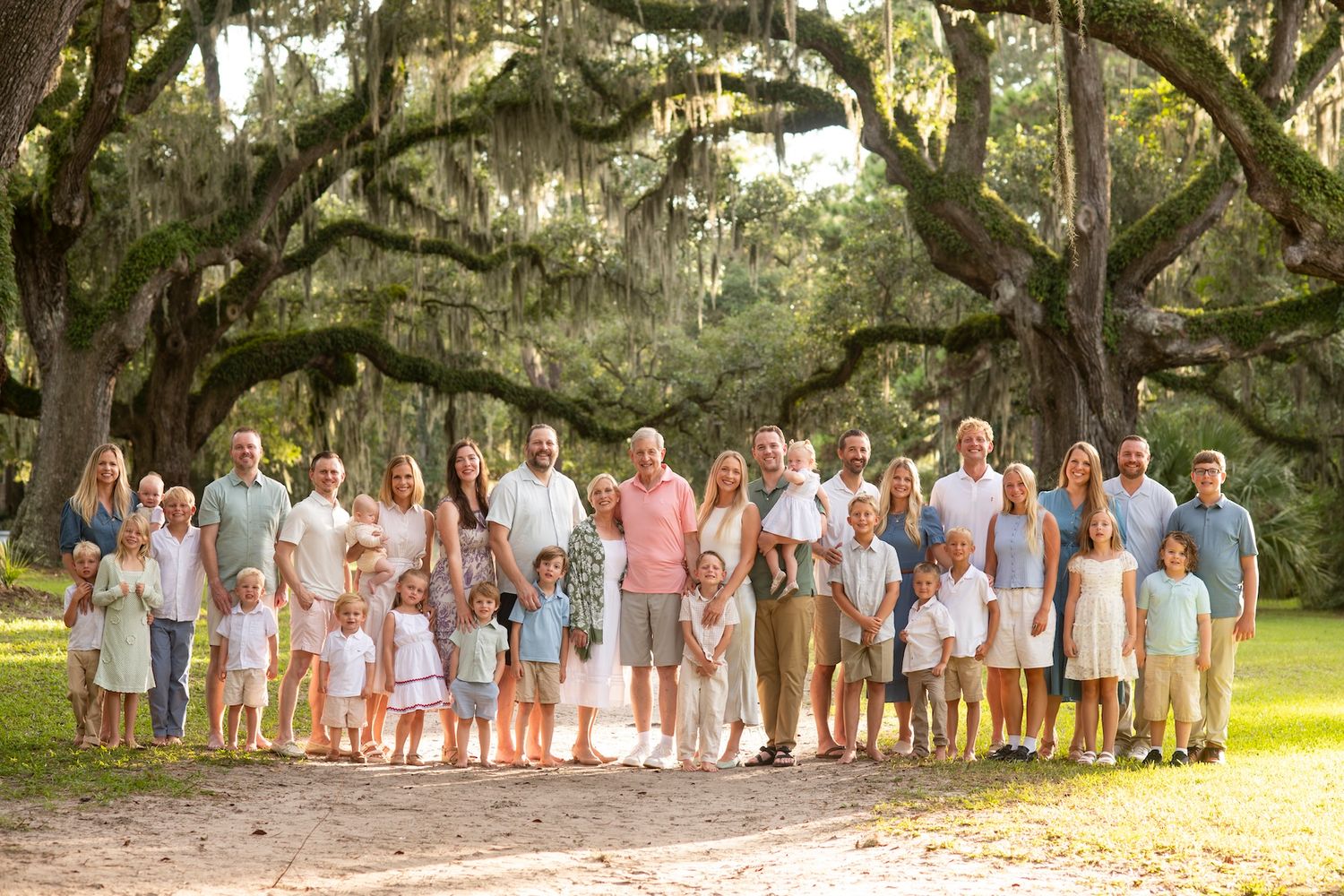 Large extended family portrait under live oak trees at Six Oaks in Sea Pines, Hilton Head Island.