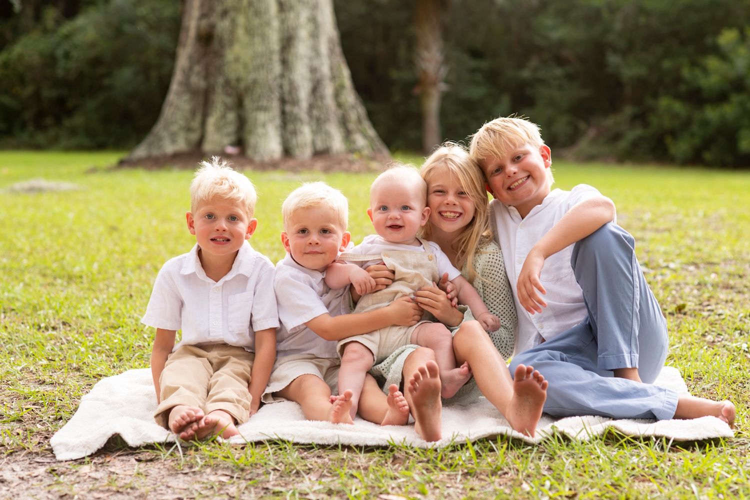 Young siblings sitting together during a Hilton Head Island family photography session.