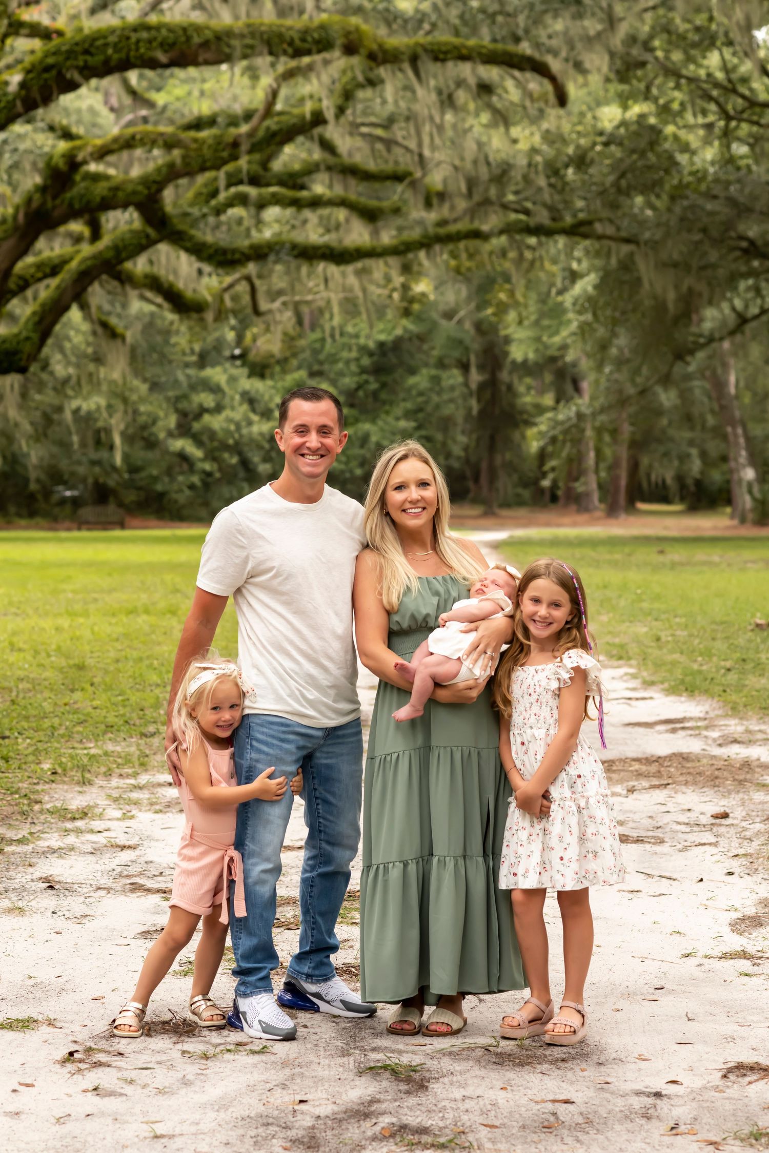 Family portrait session in a scenic park with Spanish moss draped trees on Hilton Head Island.