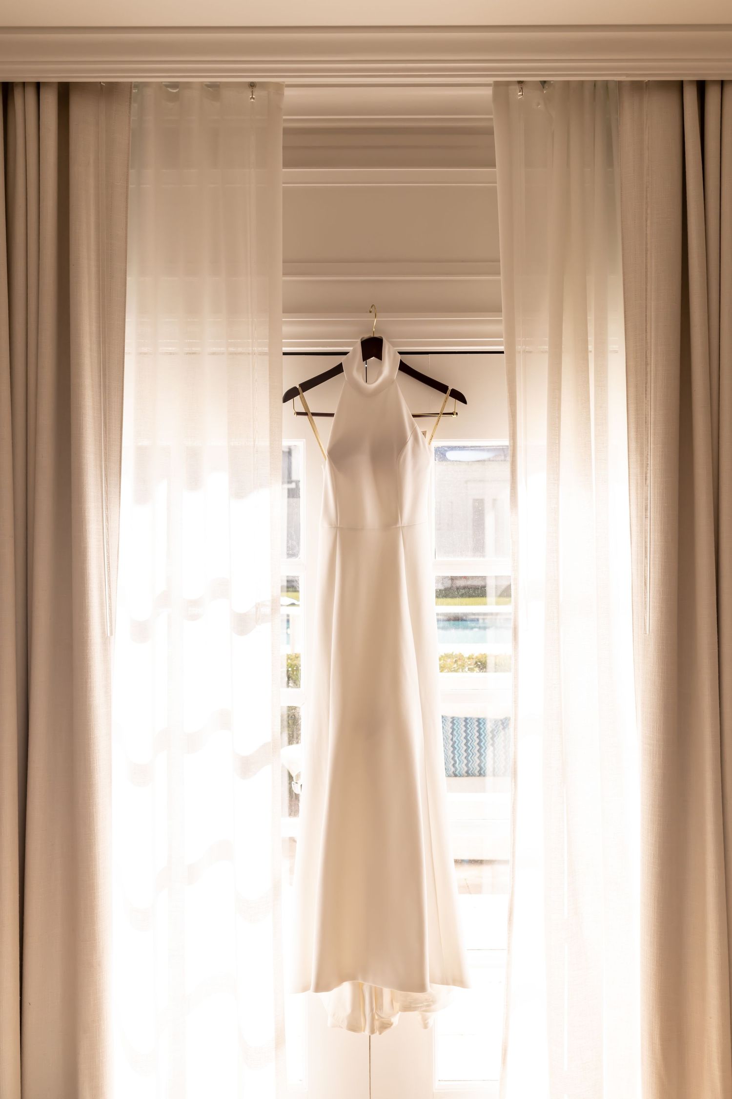 Wedding dress hanging at the Kimpton Brice Hotel Wedding in Savannah, Georgia.